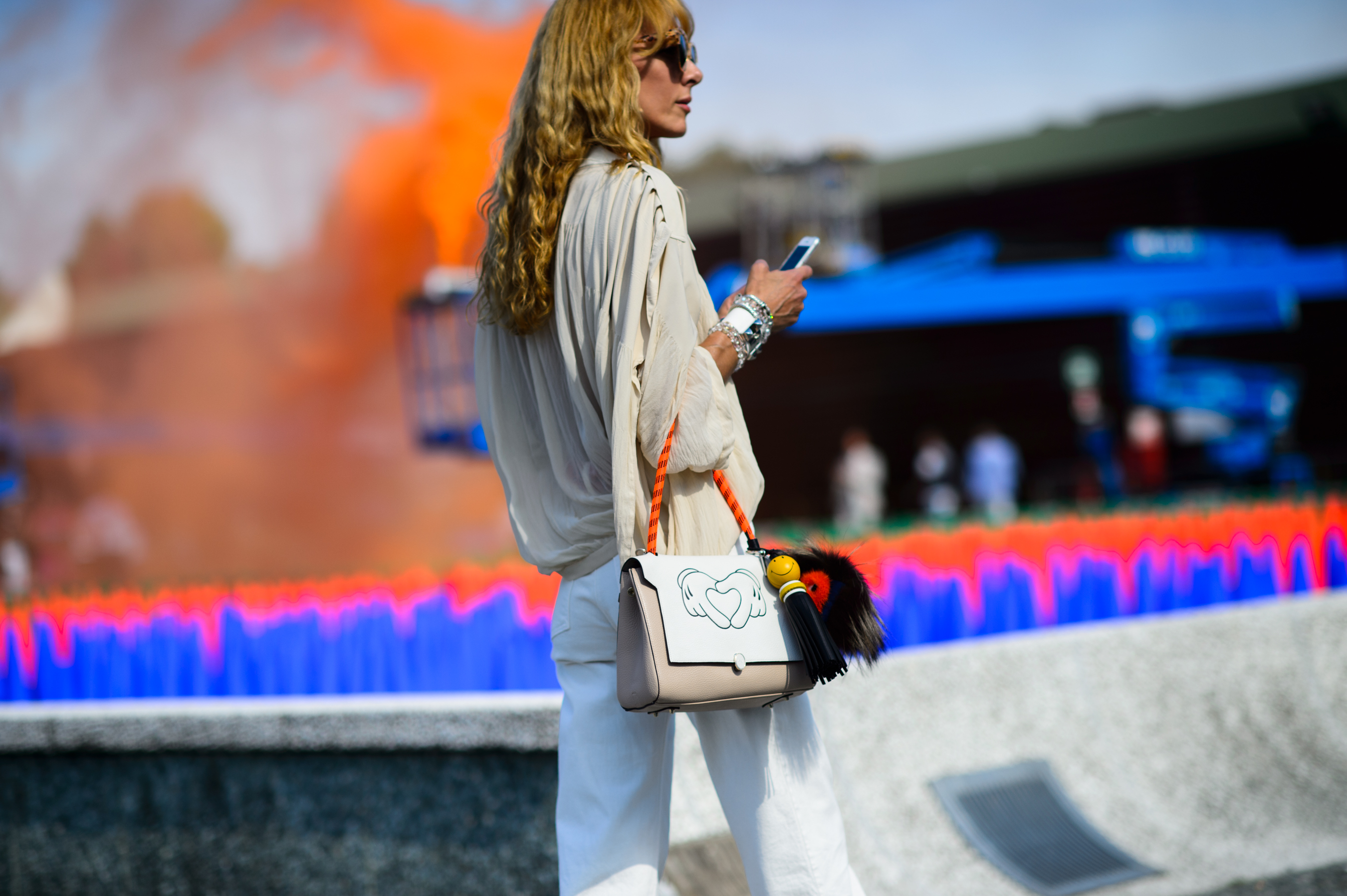 Woman with orange smoke in the background