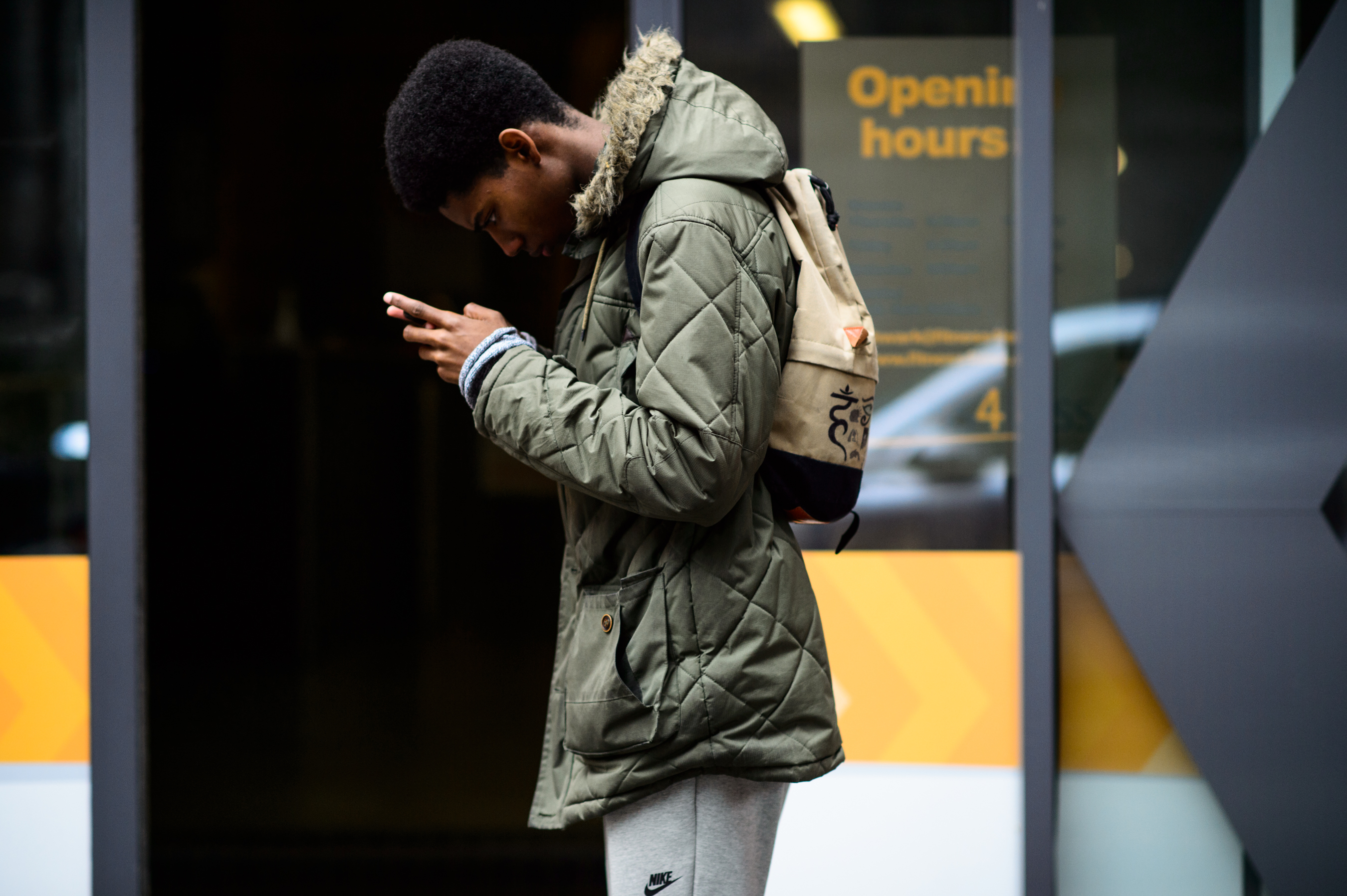 Male model texting after a show