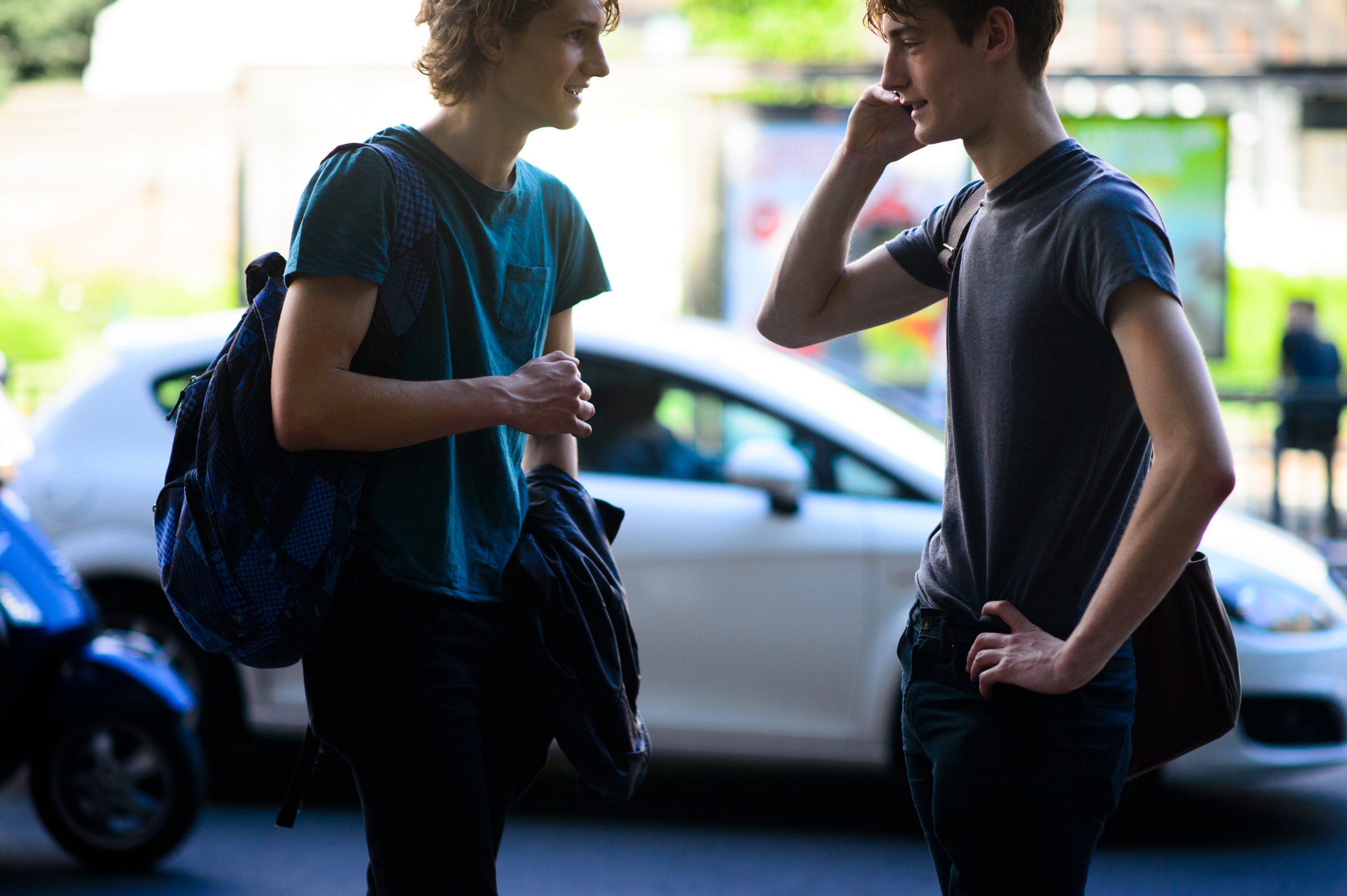 Two male models after a fashion show