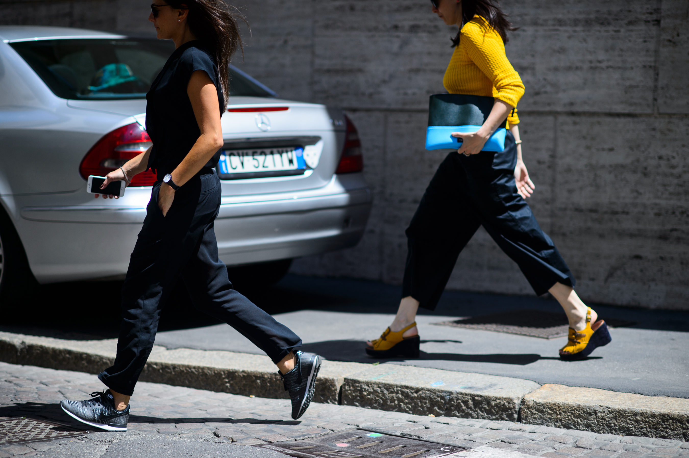 Two women walking to a show