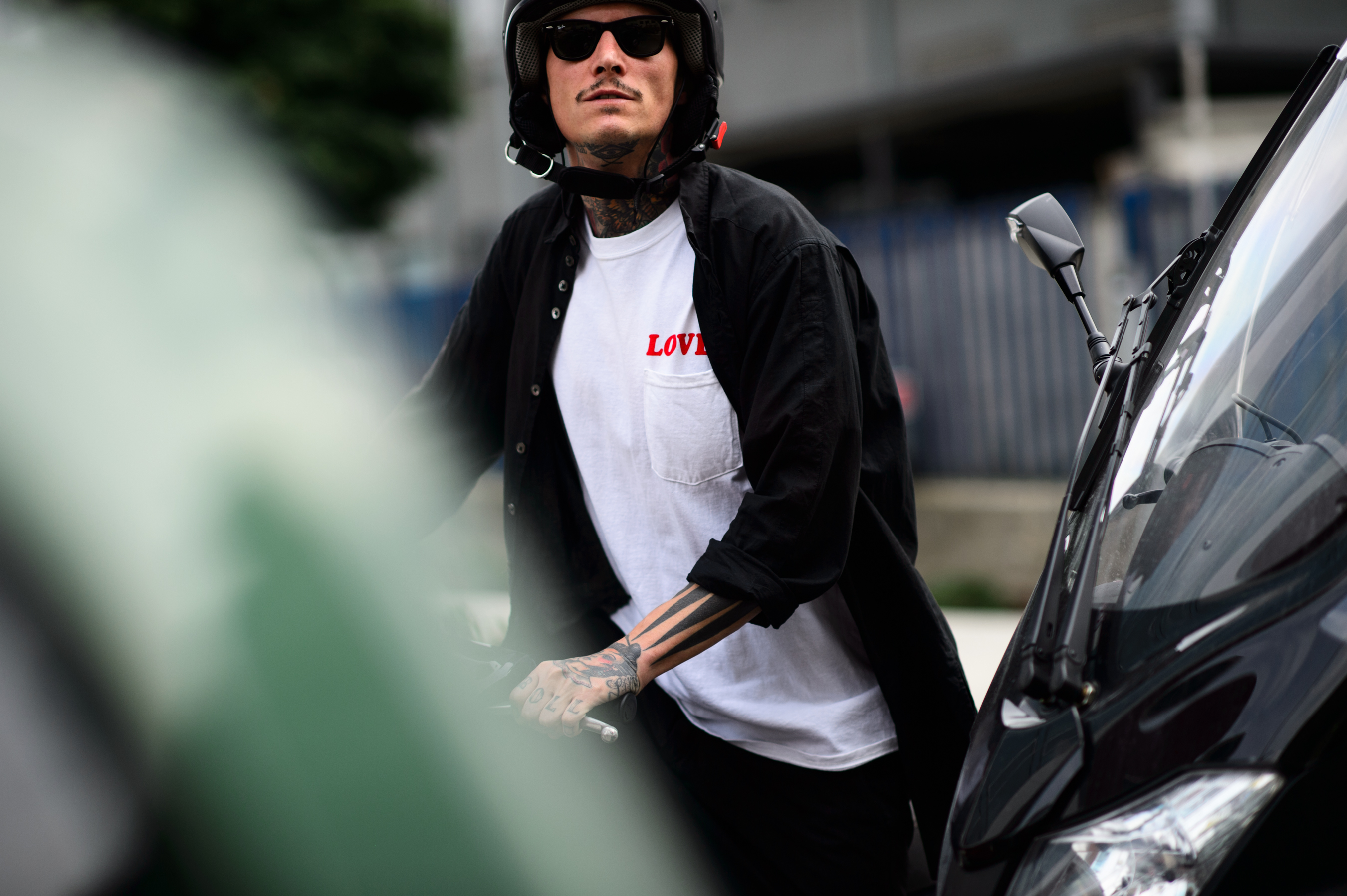 Tattooed man wearing Bianca Chandôn LOVER shirt