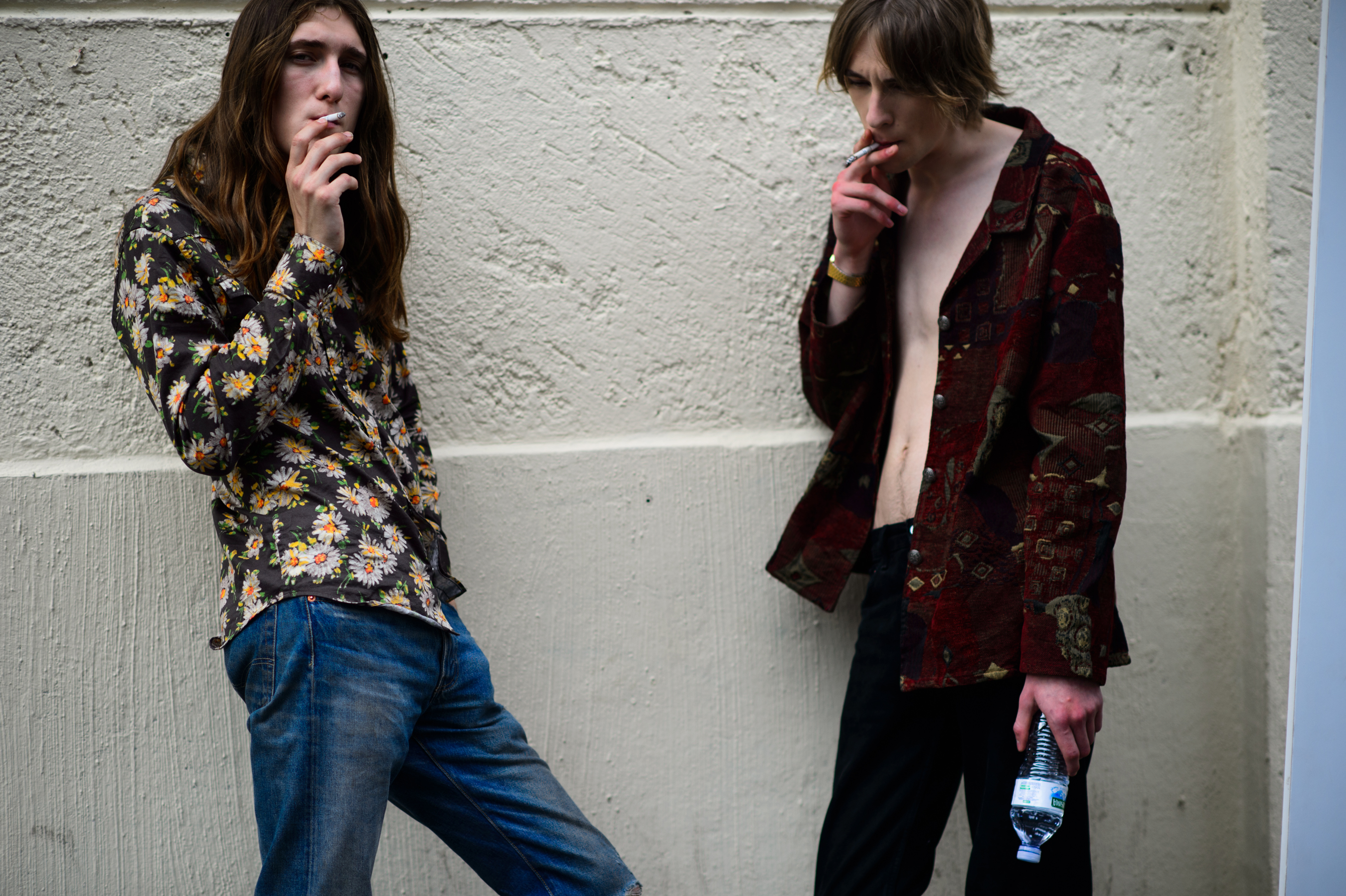 Male models smoking before the show