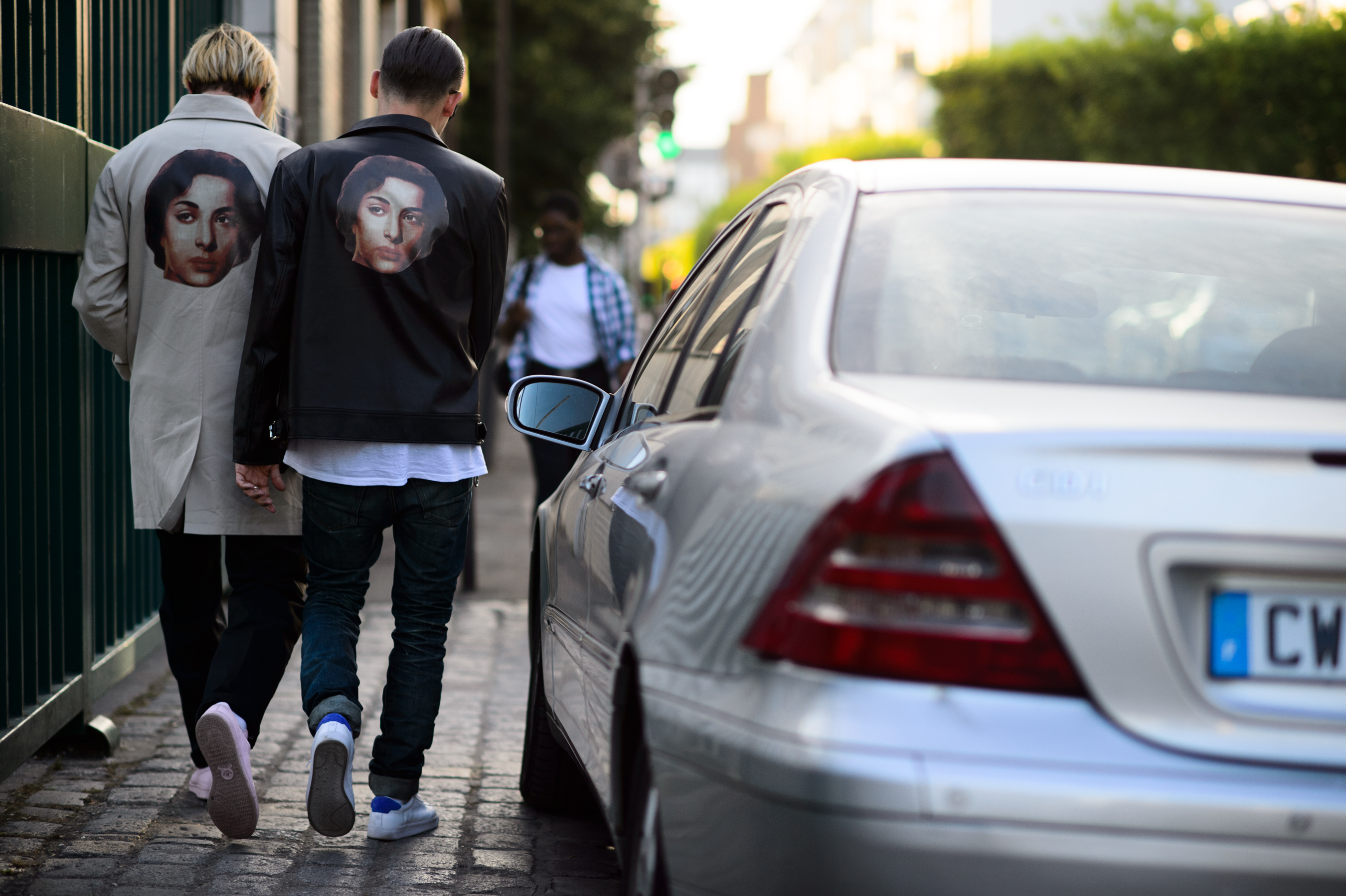 Two men wearing matching jackets