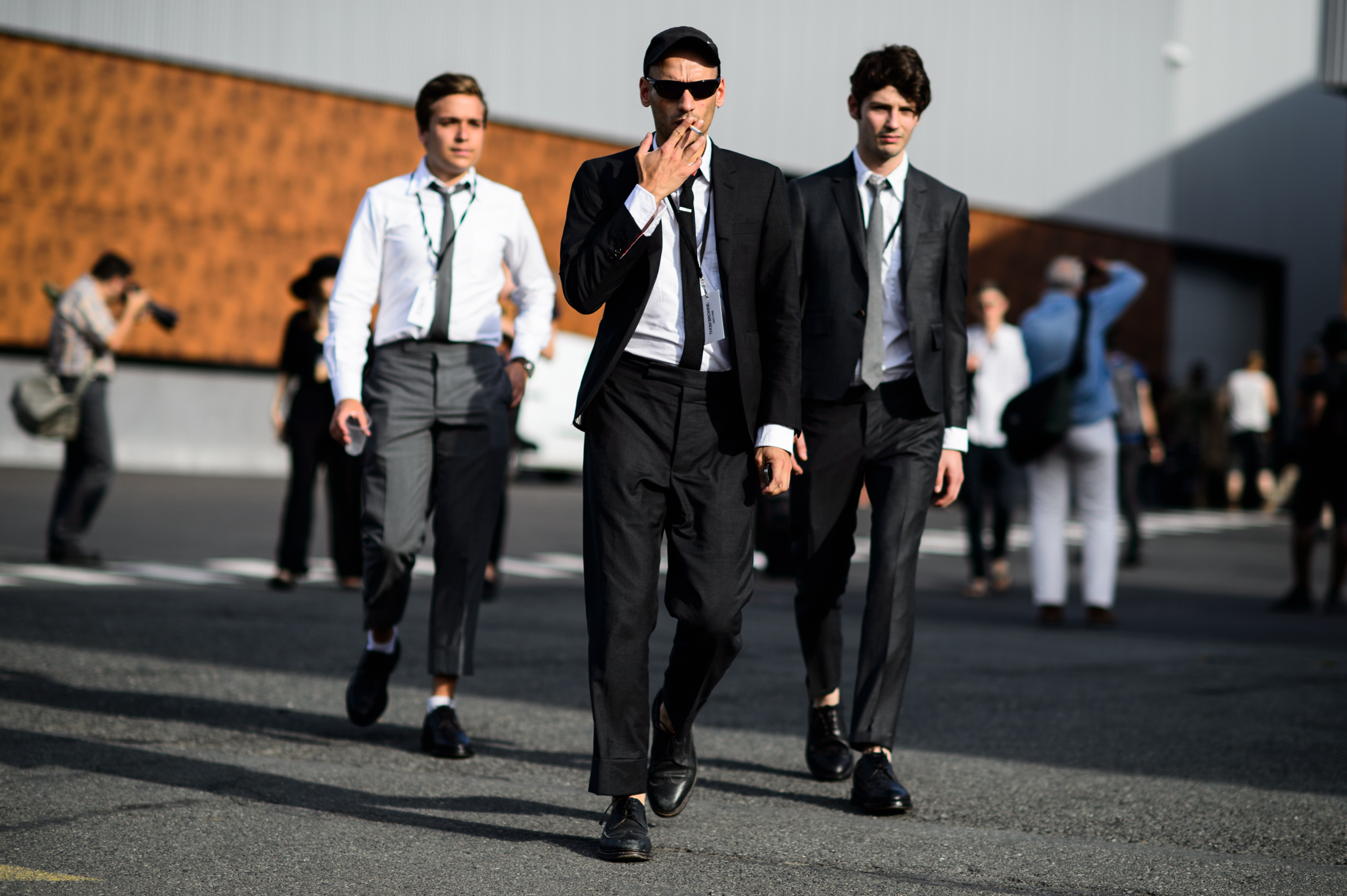 Three men wearing grey suits