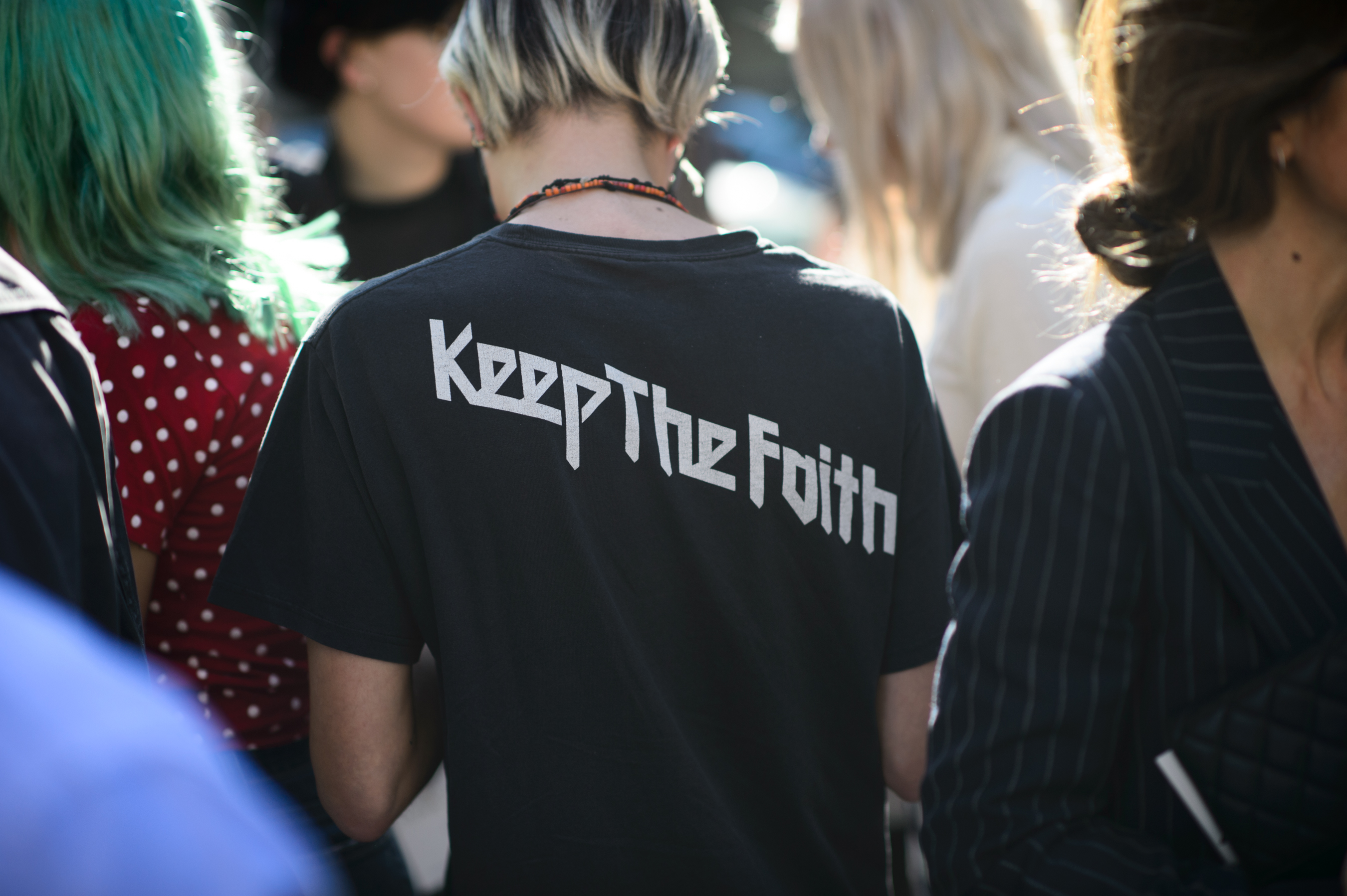 Man wearing a Keep the Faith shirt