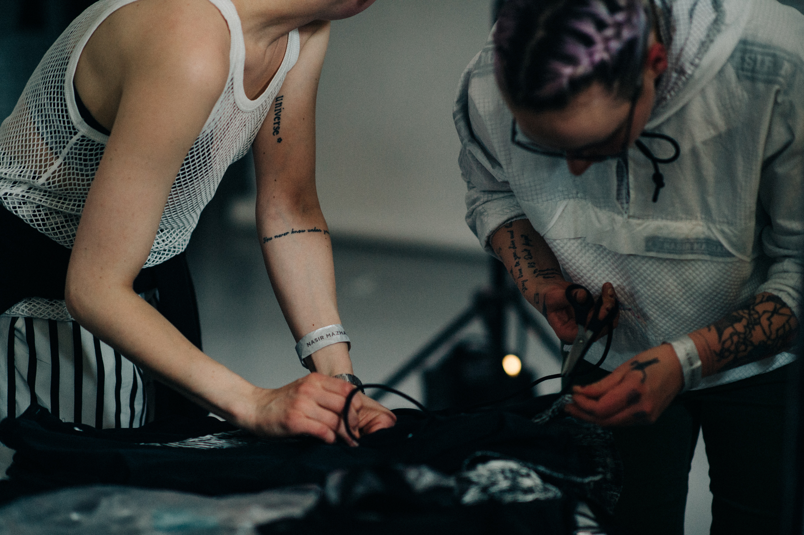 People fixing clothes before the show