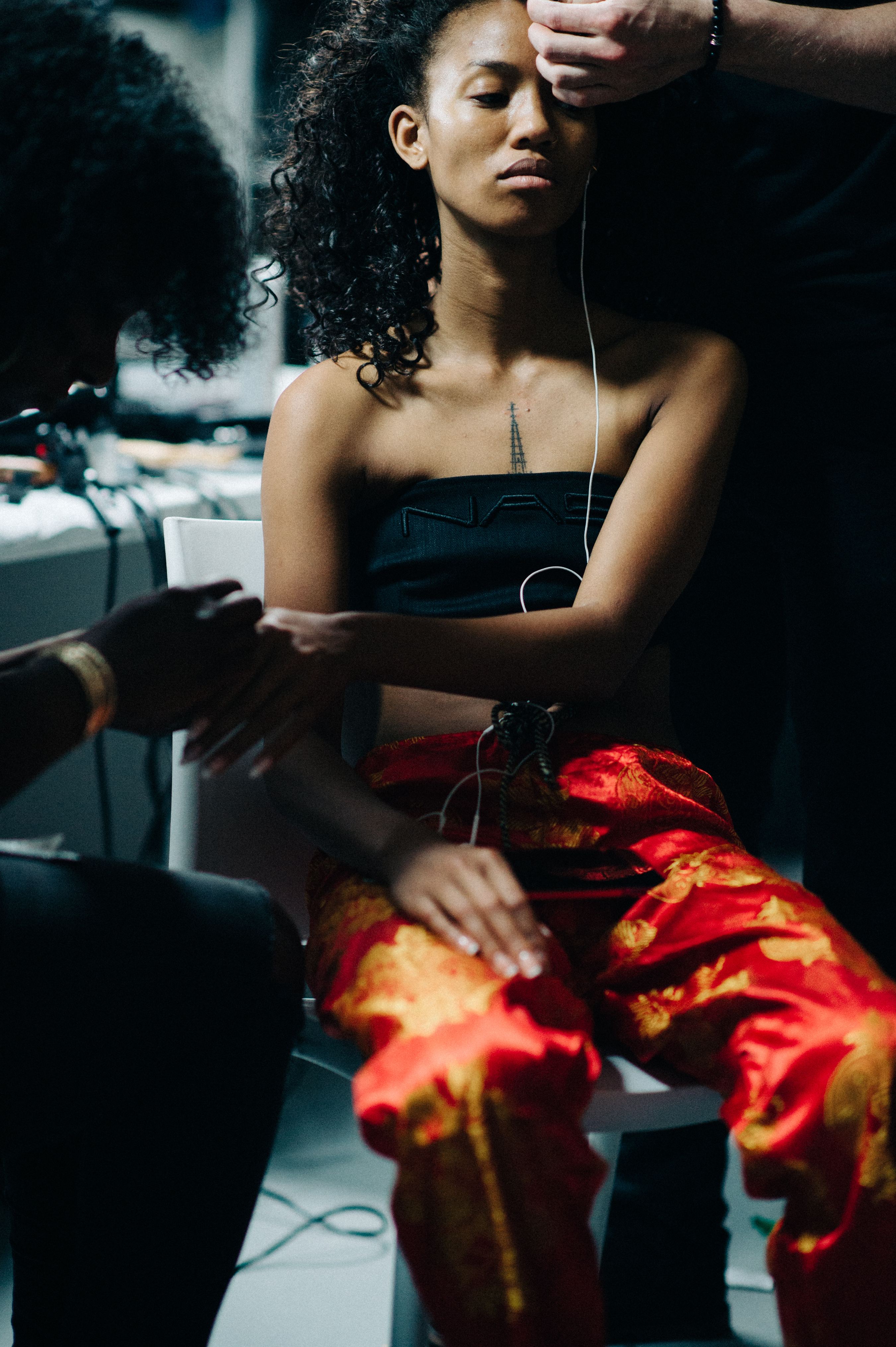 Model getting make up and hair done