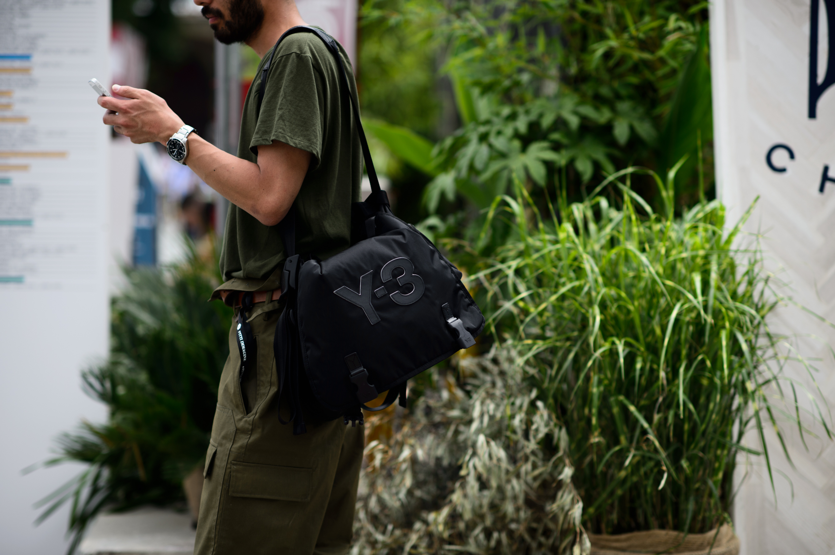Asian man with a Y-3 bag