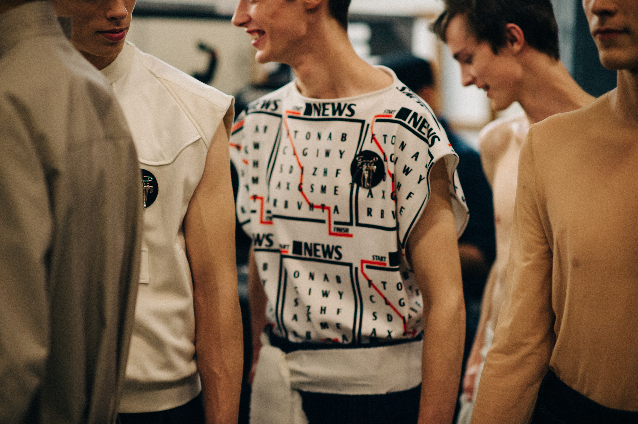 Male models Paulius Meskauskas, Asger Nedergaard, Jesper Trip before the show