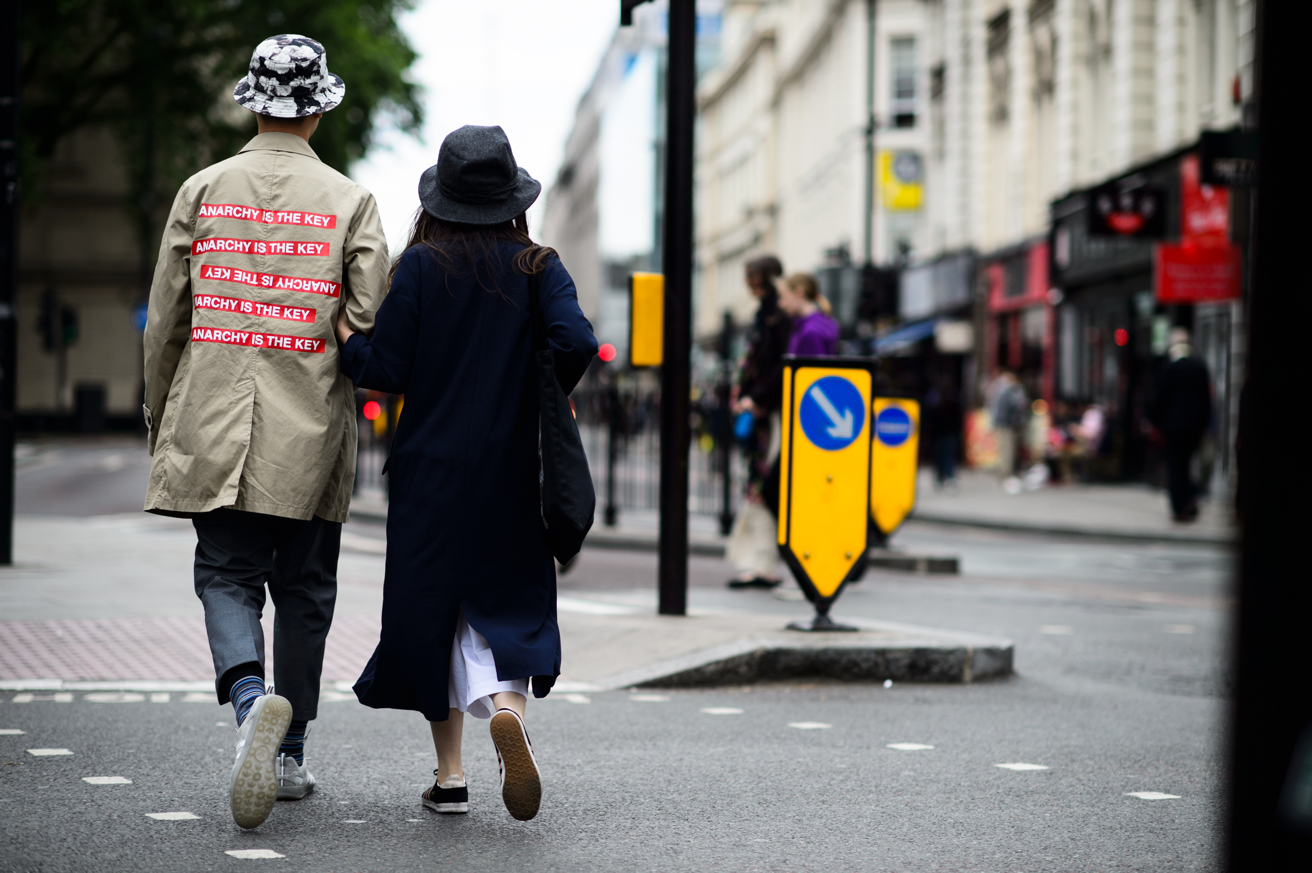 Man wearing Supreme x Undercover trench