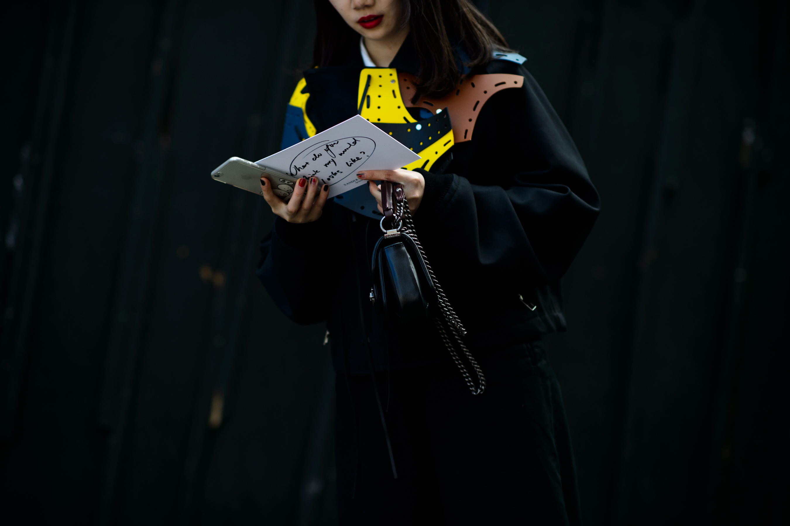 Asian woman wearing a Loewe jacket