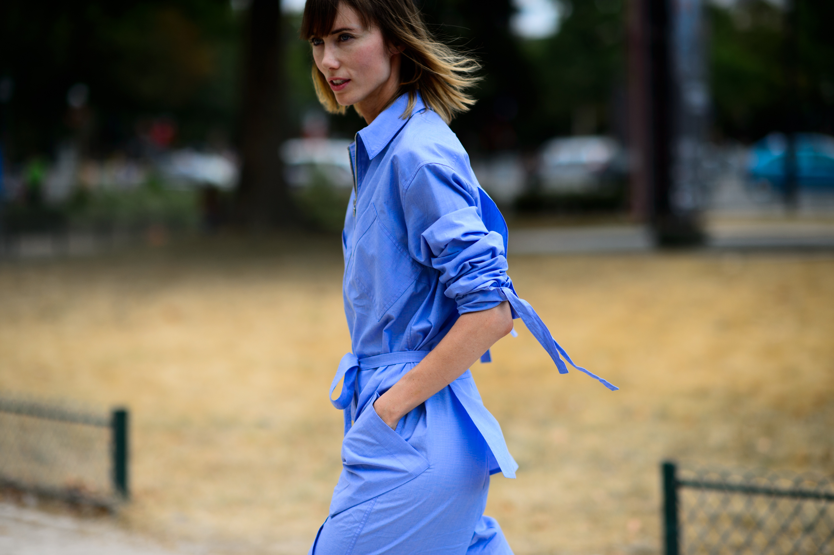 Russian editor wearing a blue jumpsuit