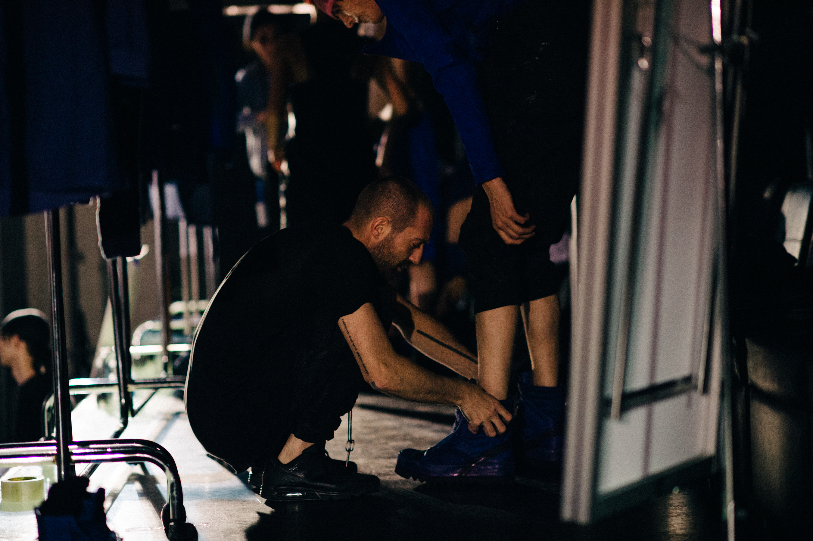 Designer doing the last touch ups before the spring summer 16 show