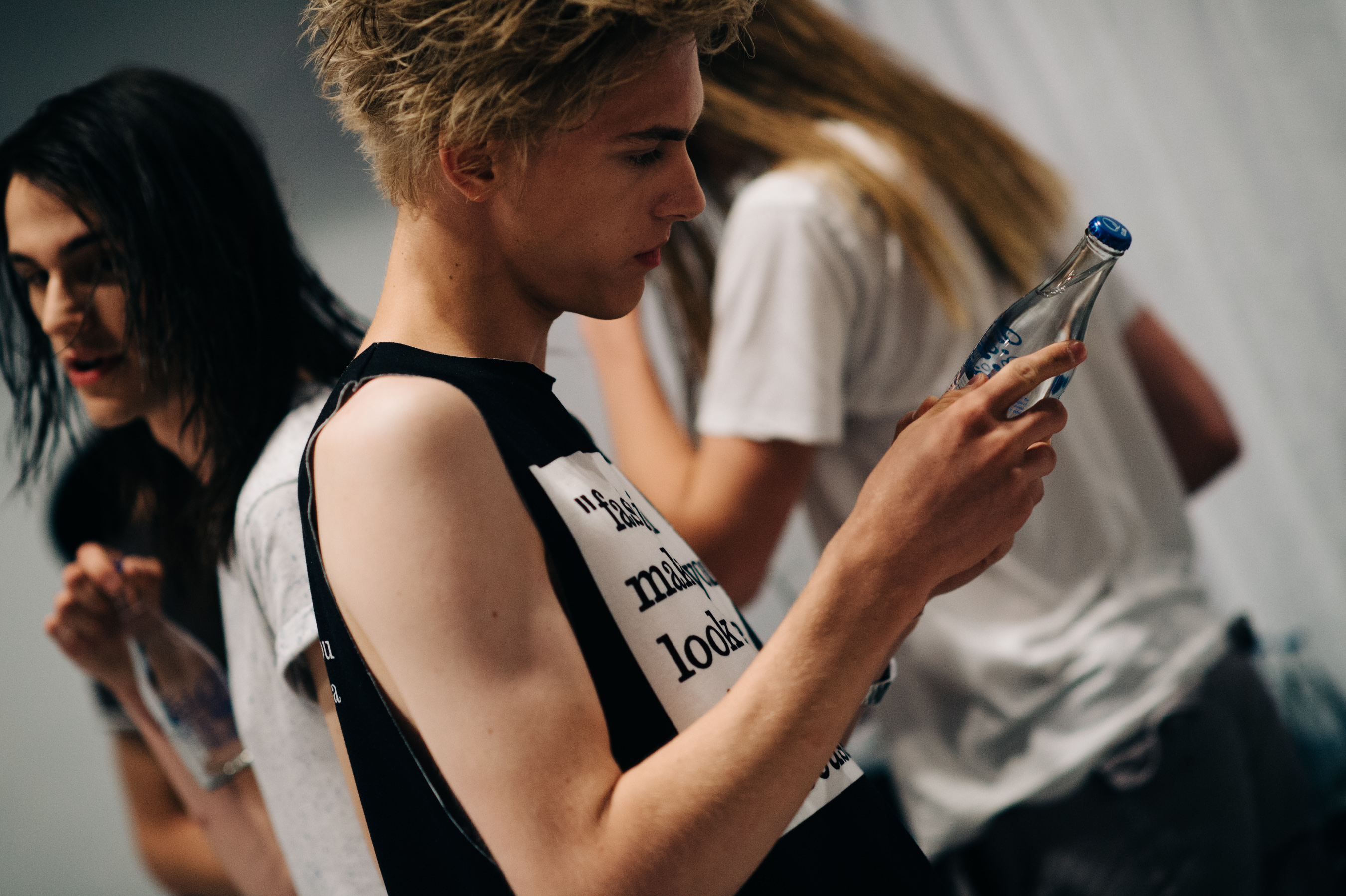 Blonde male model before the show