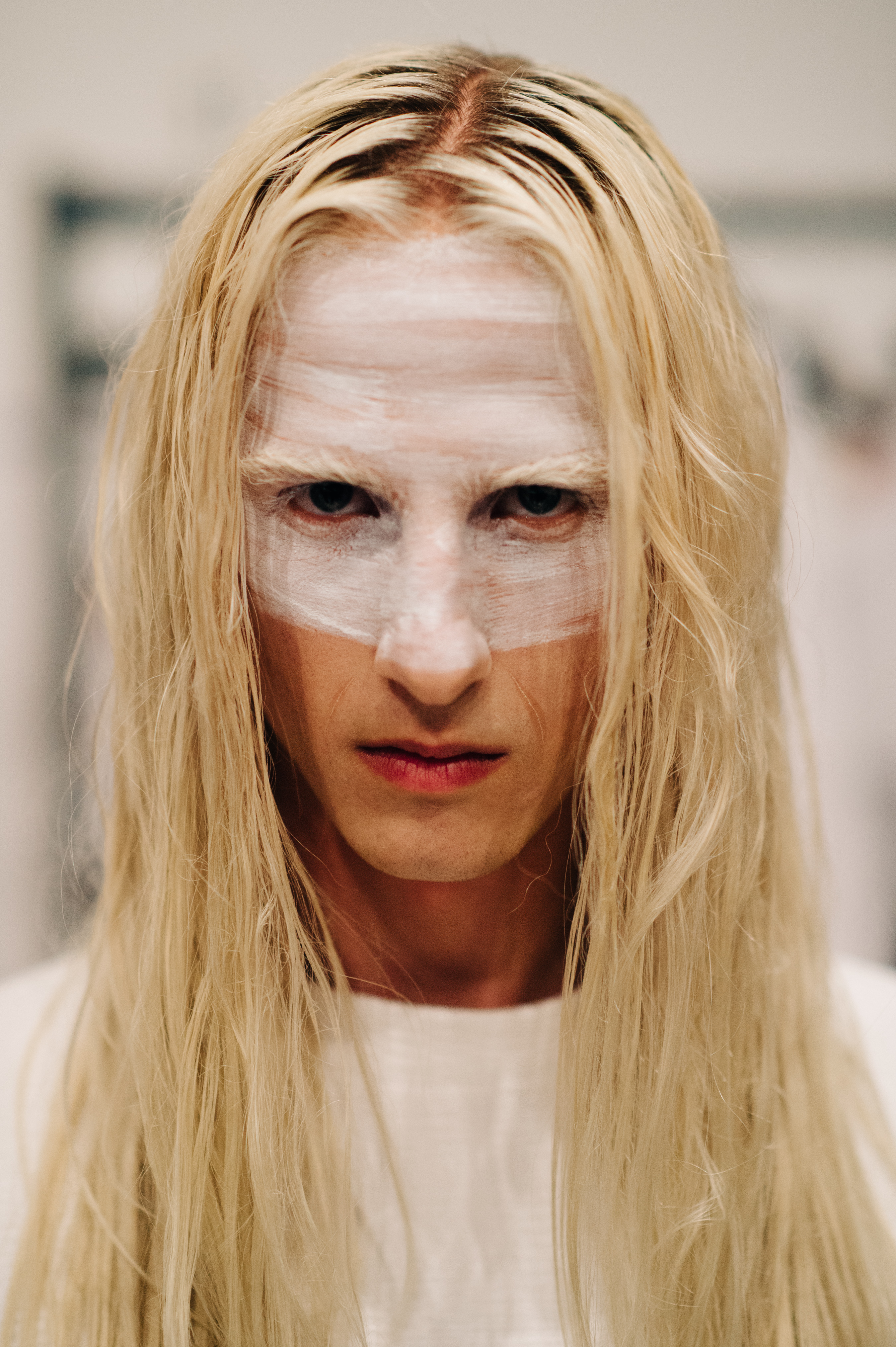 Portrait of male model with white make up