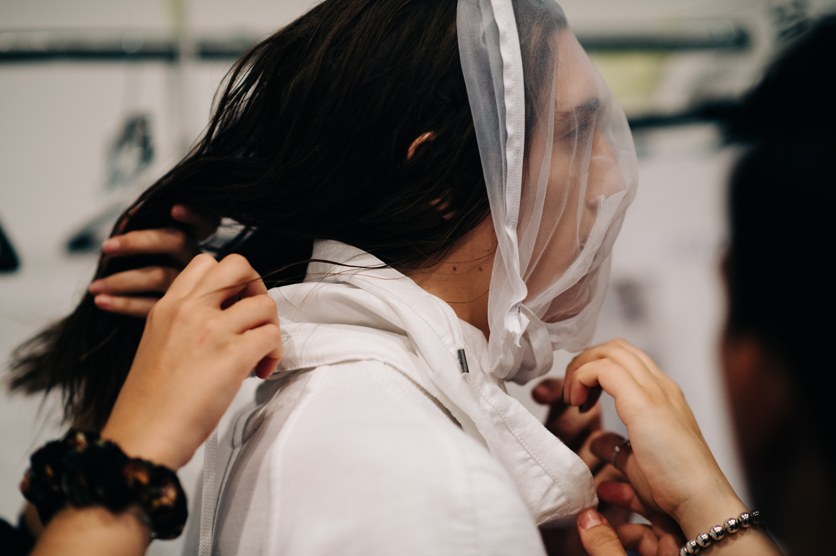 Male model is getting dressed before the show