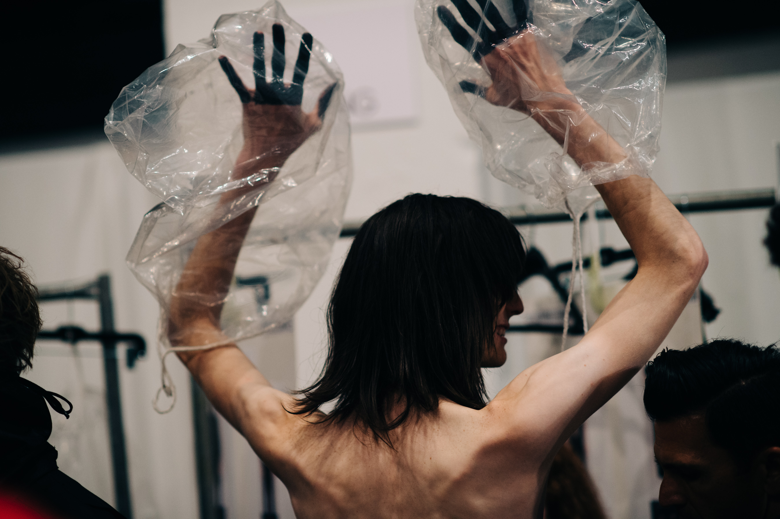 Male model with black make up of hands