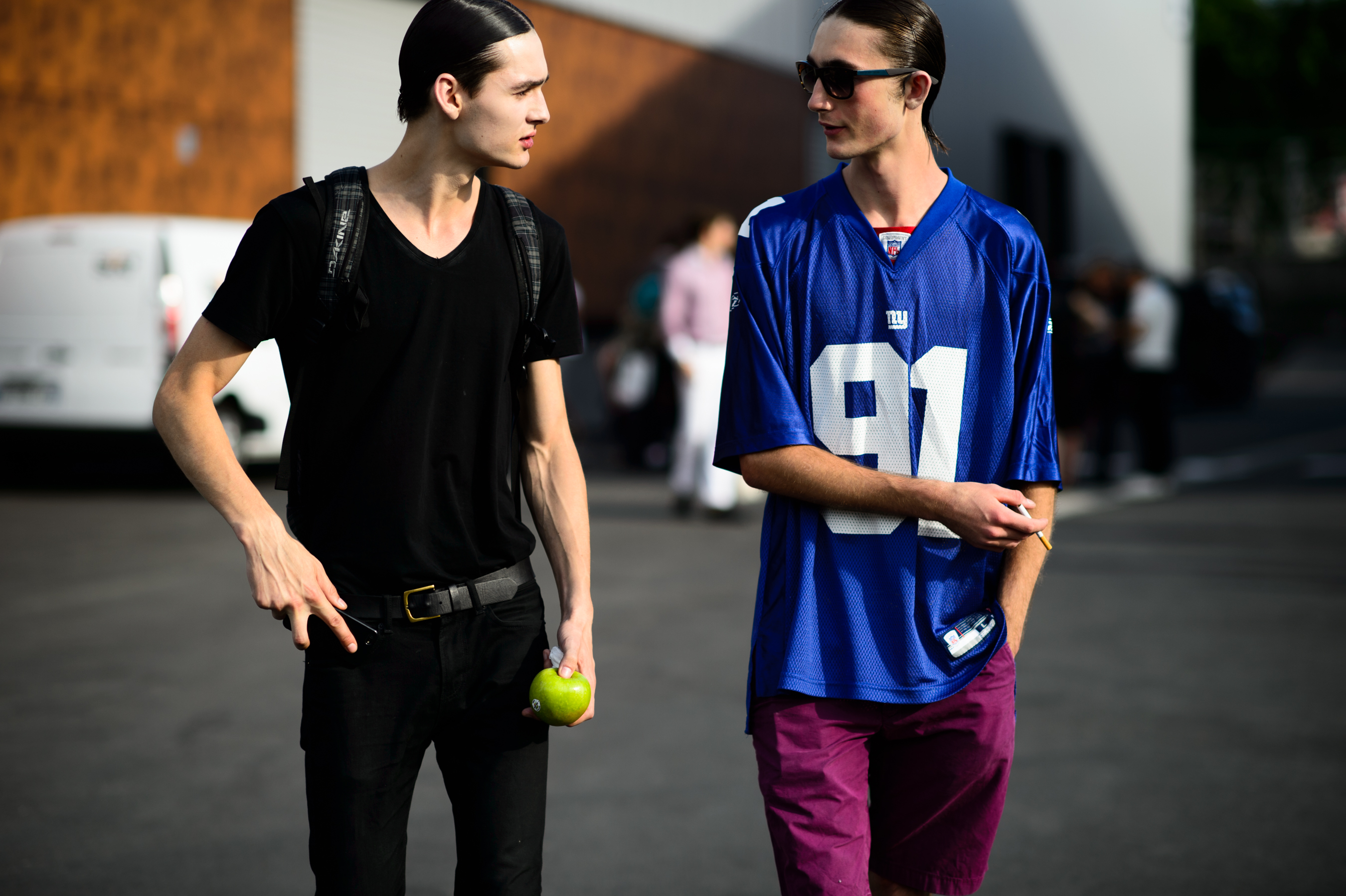 Two male models after a fashion show