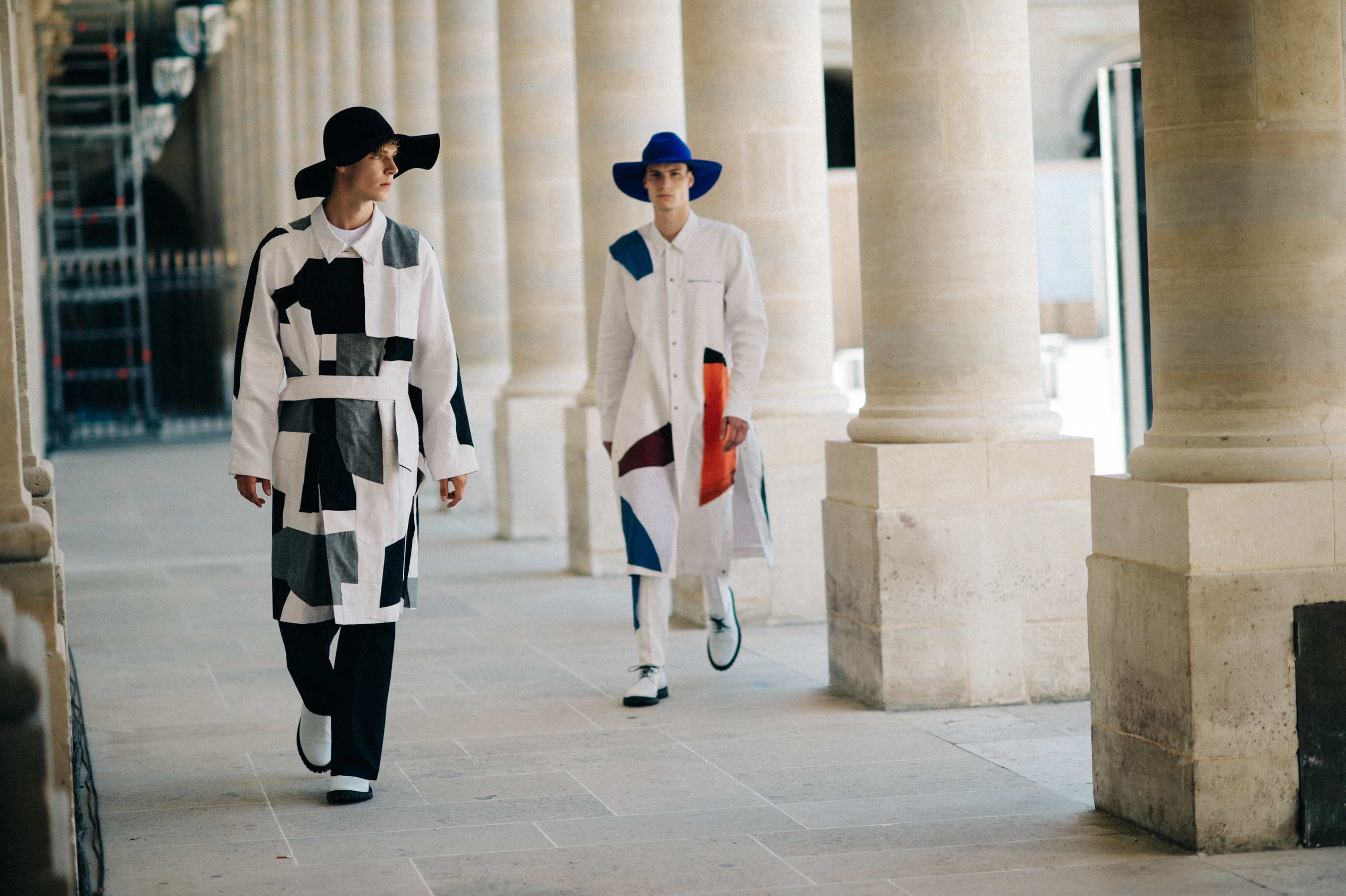 Two male models walking the show