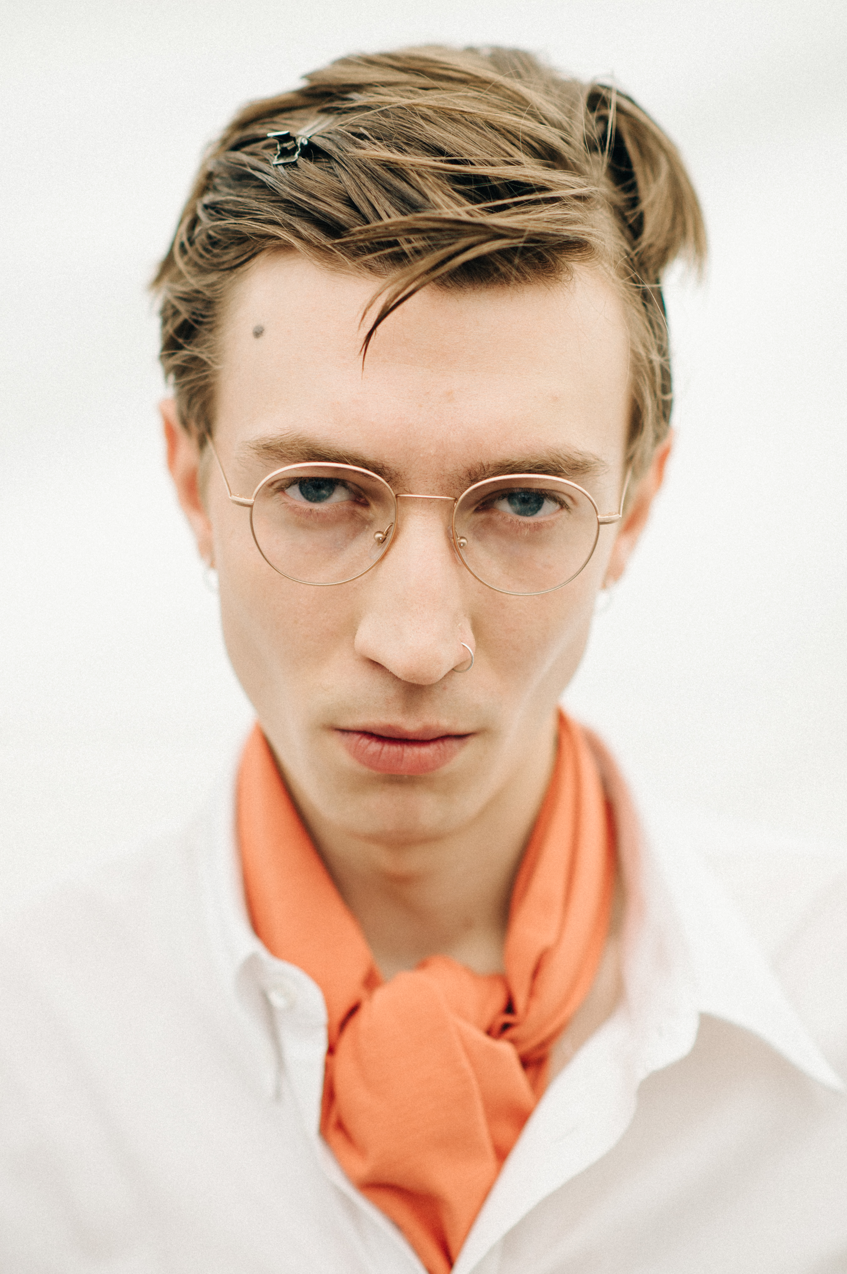 Portrait of male model in orange scarf