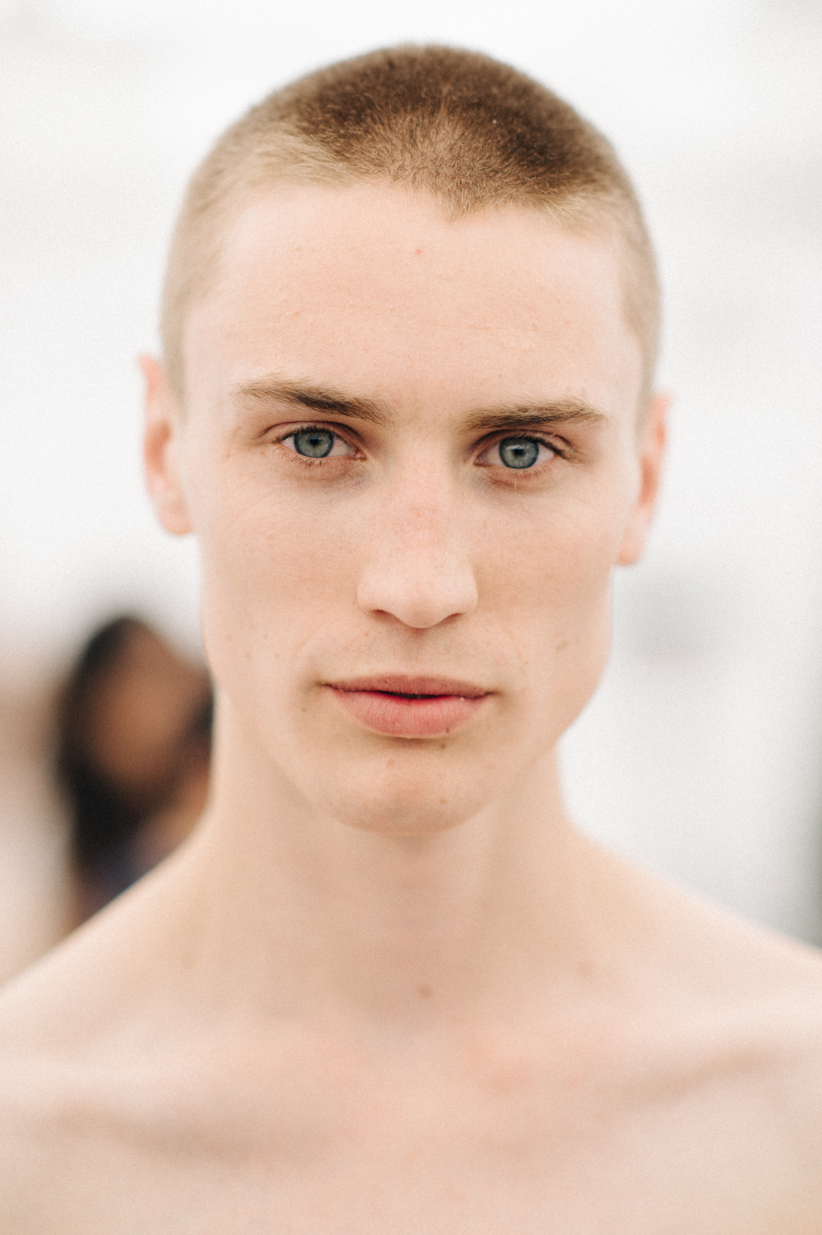 Portrait of shirtless male model with short hair