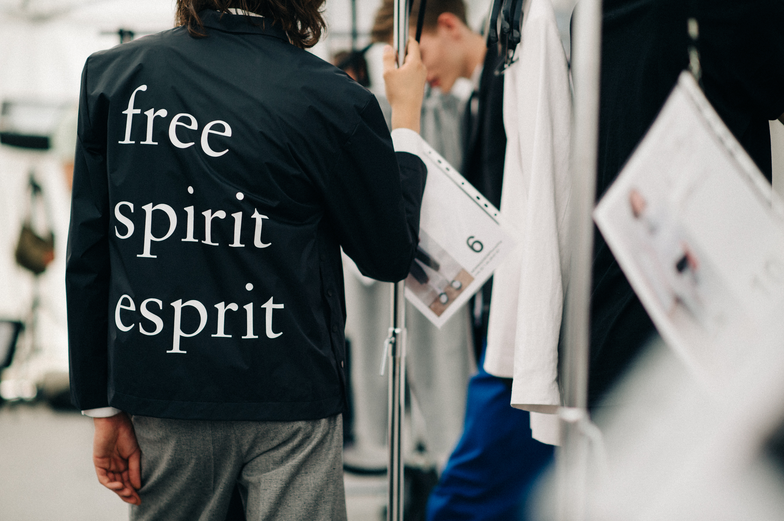 Man wearing leather jacket with typeface in the dressing room