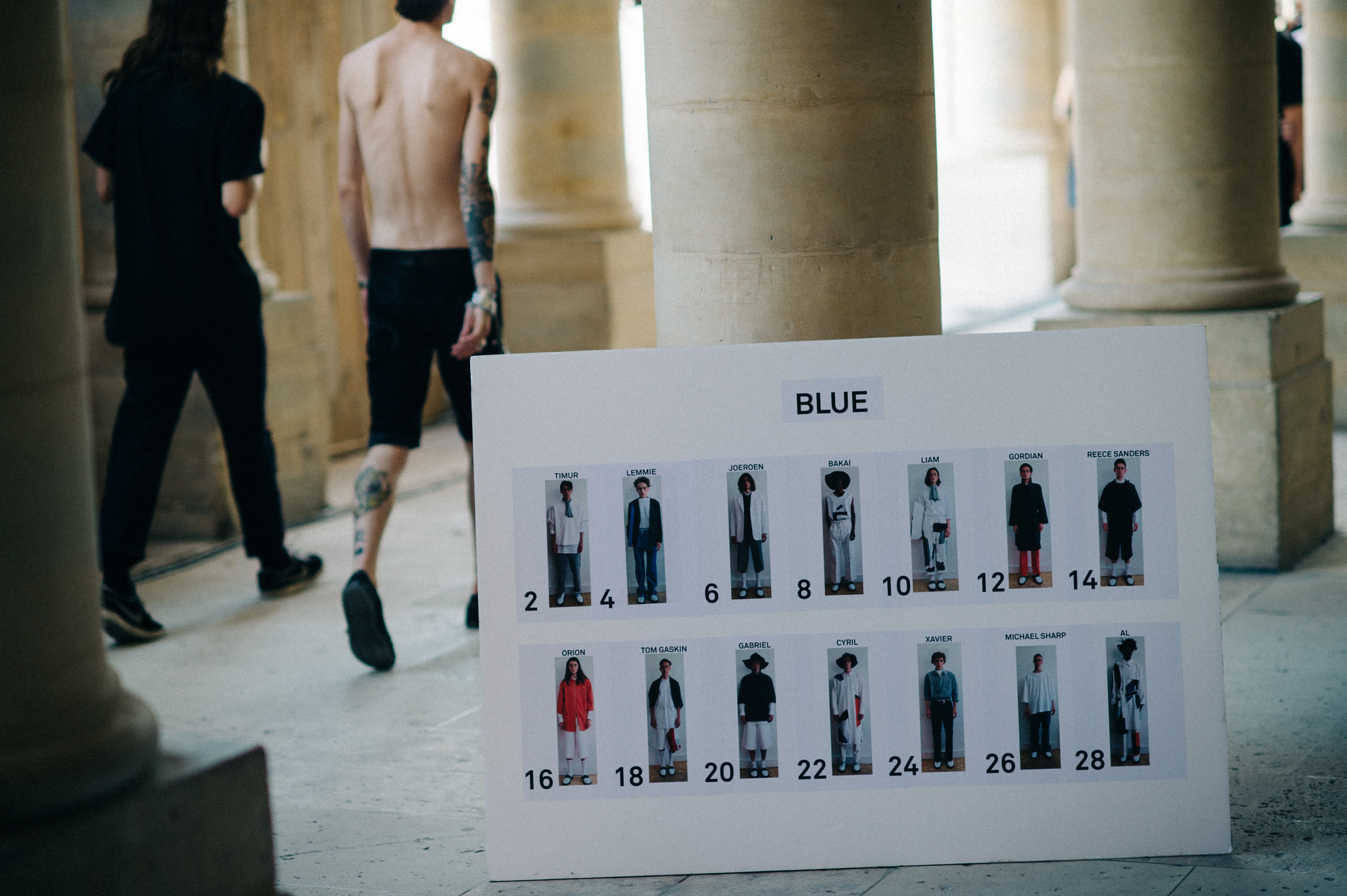 Two male models walking during the rehearsal