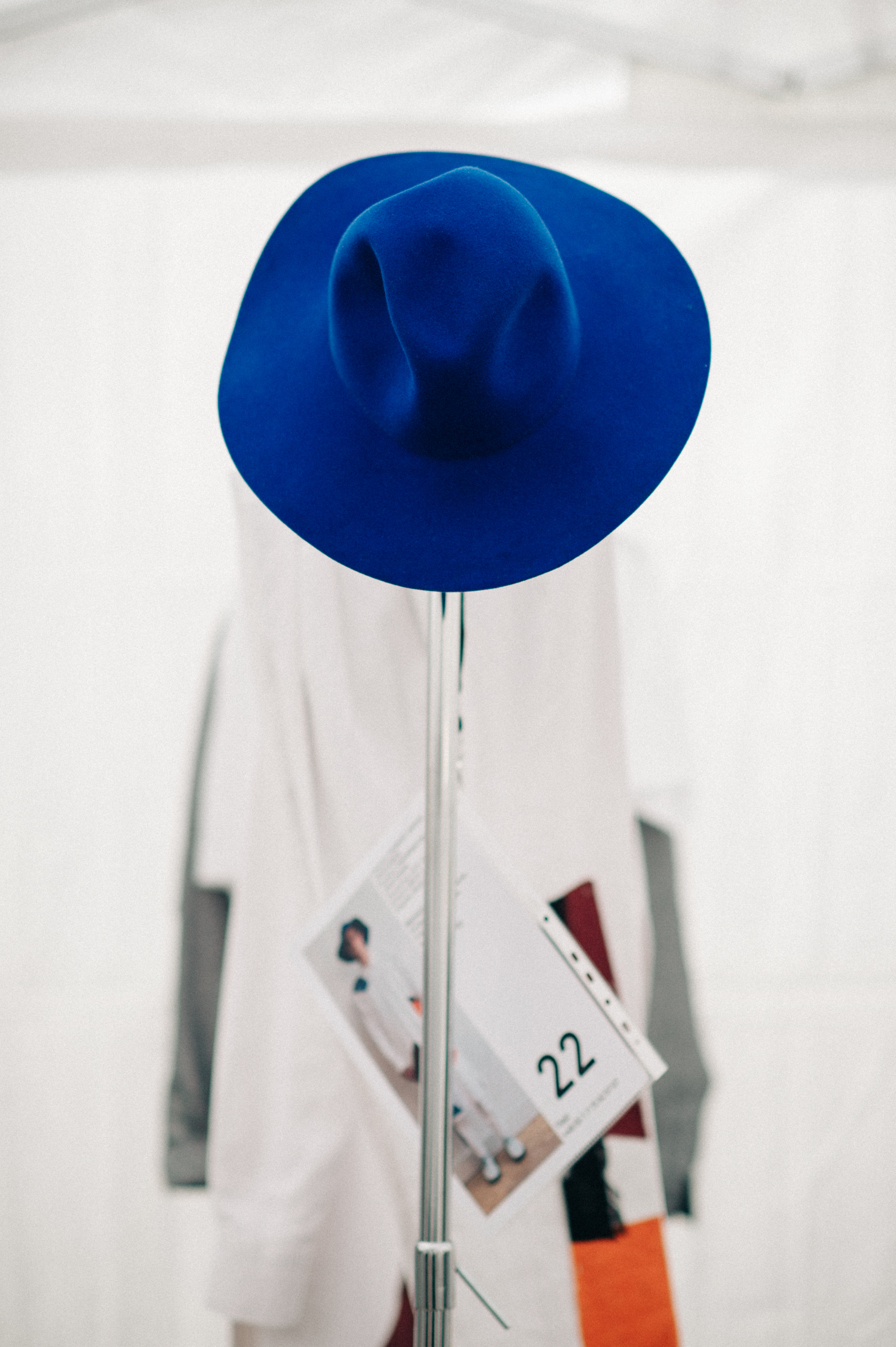 Blue hat on the hanger in the dressing rom