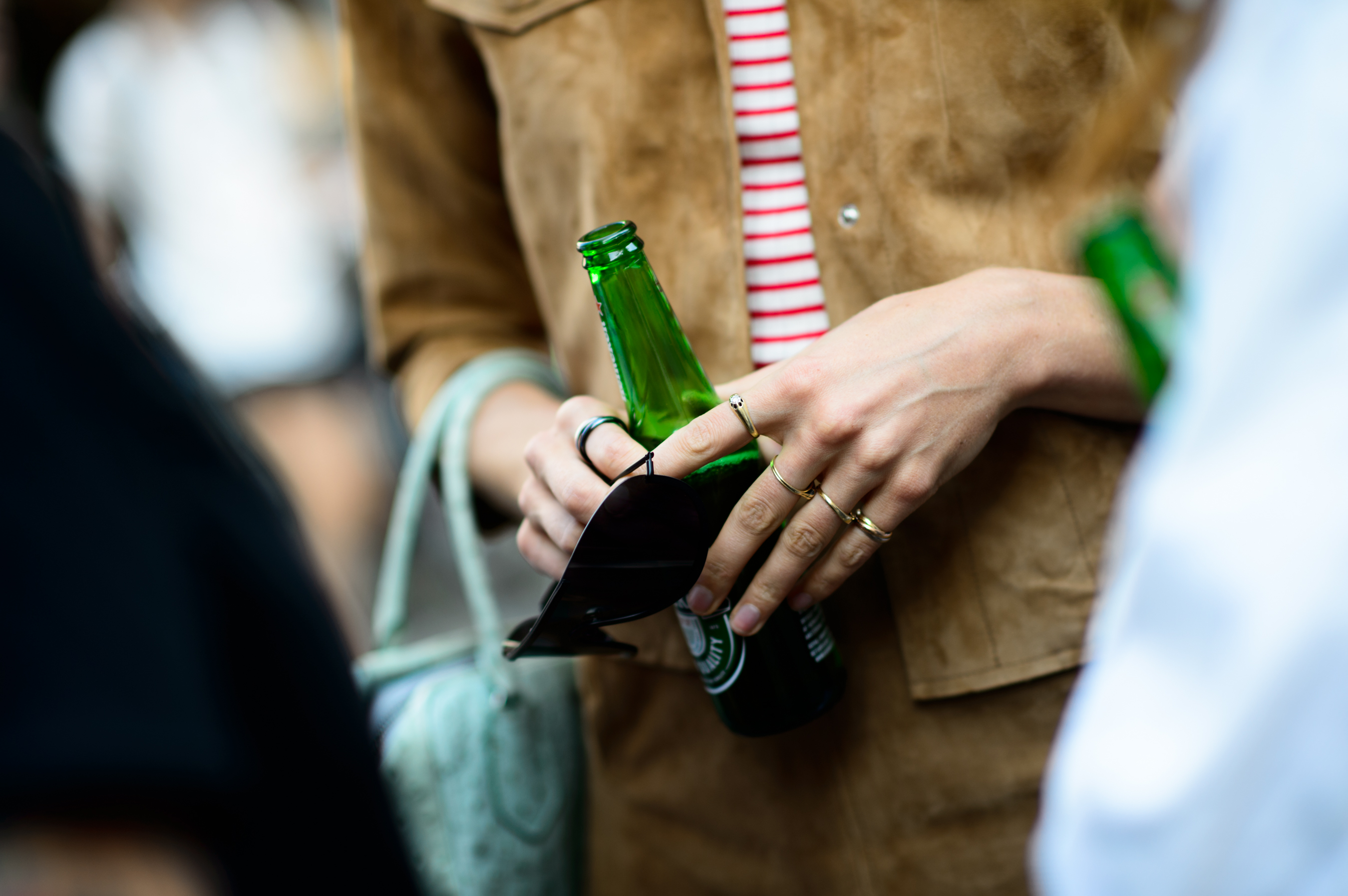 Woman holding a beer at the street party