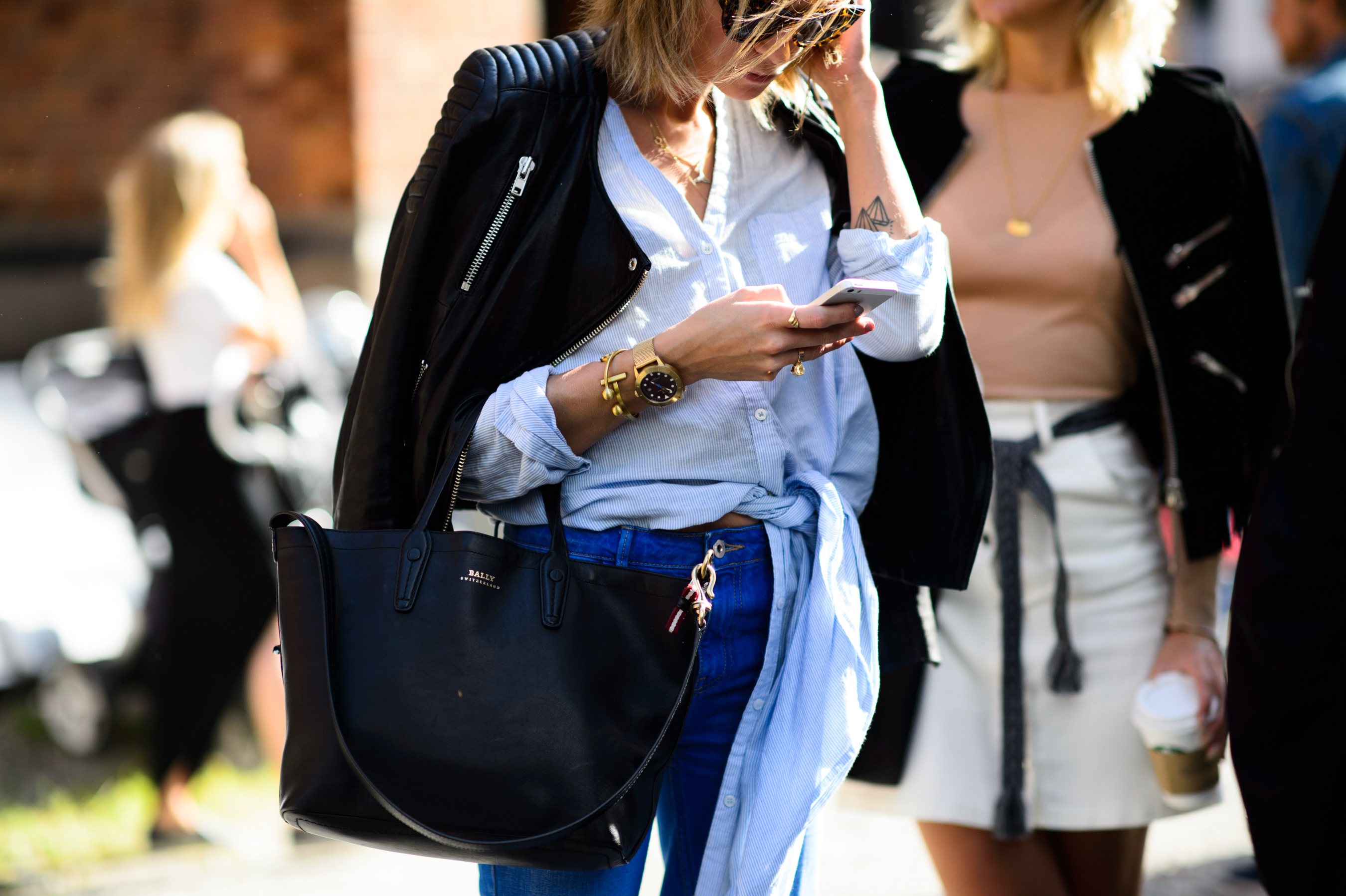 A woman in leather jacket before the fashion show