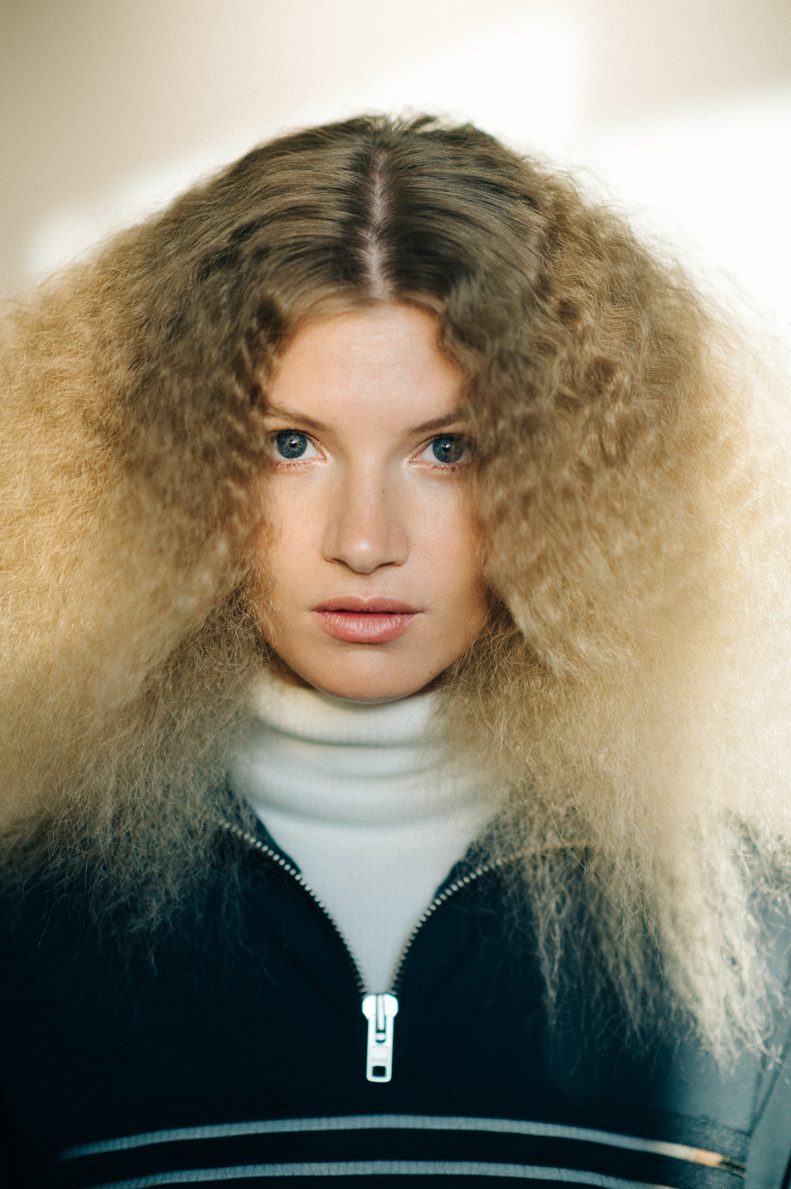 Portrait of curly haired model before the show