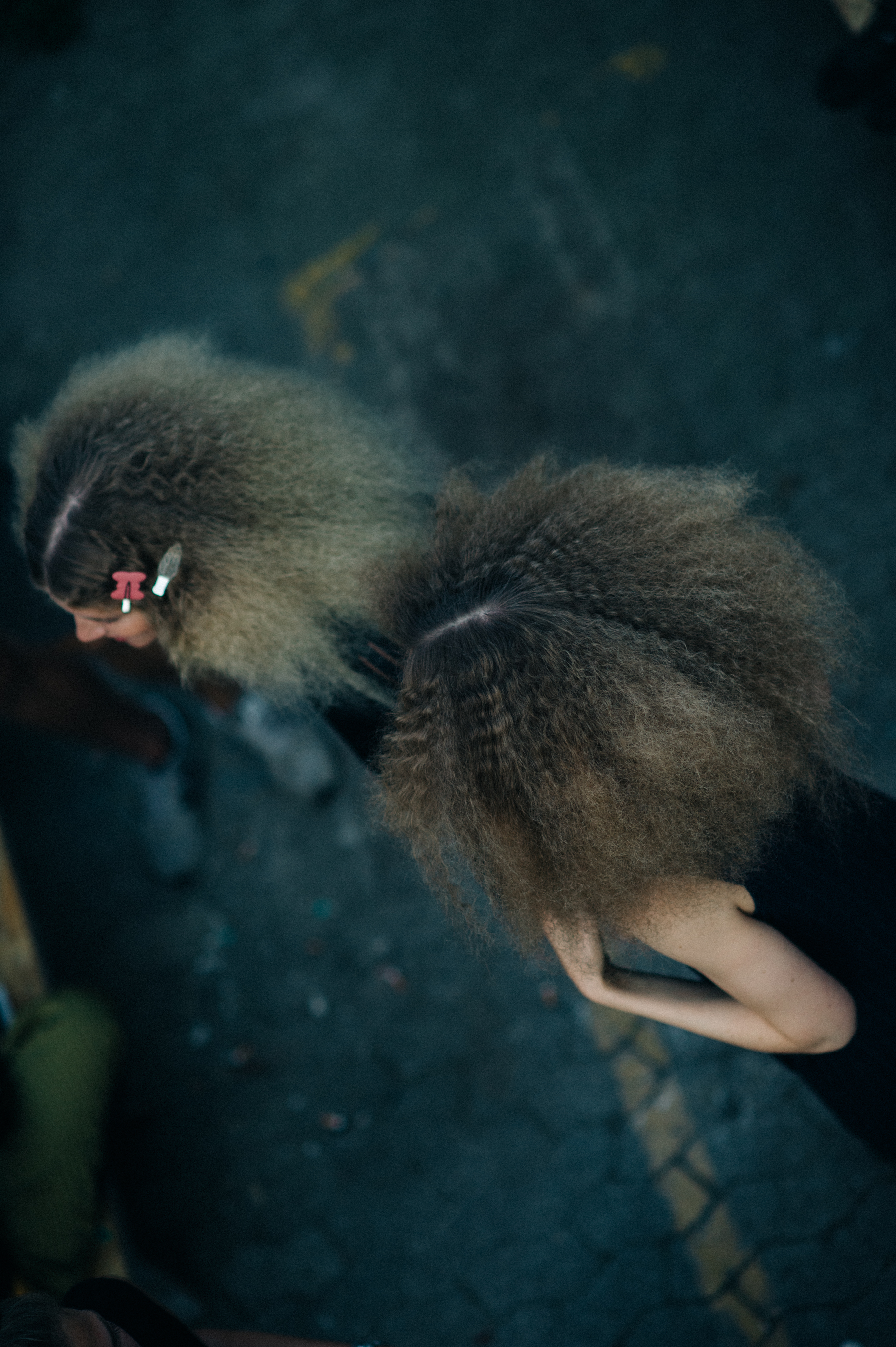 Top view of two model's big curly hair