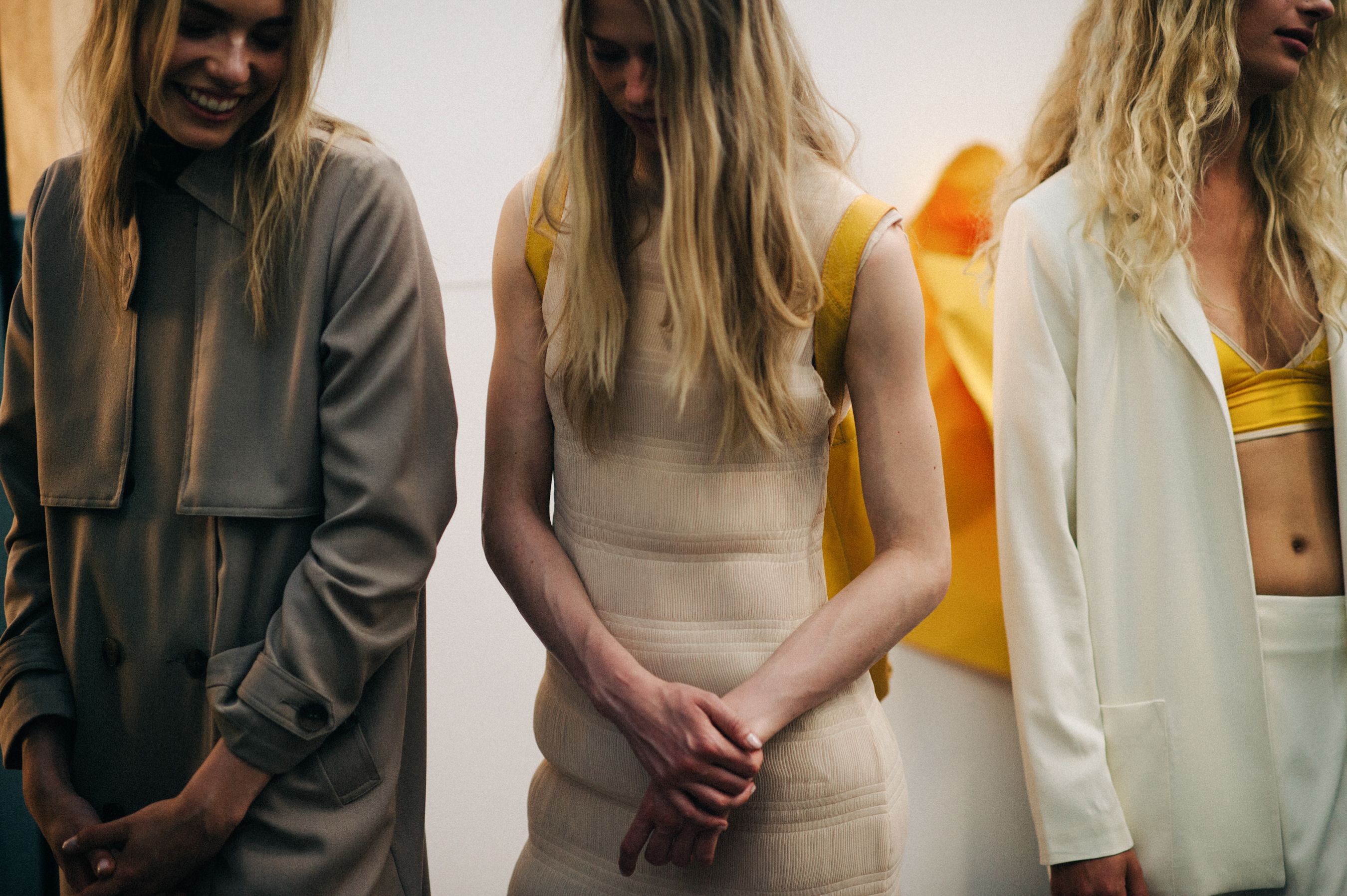 Three female models before the show