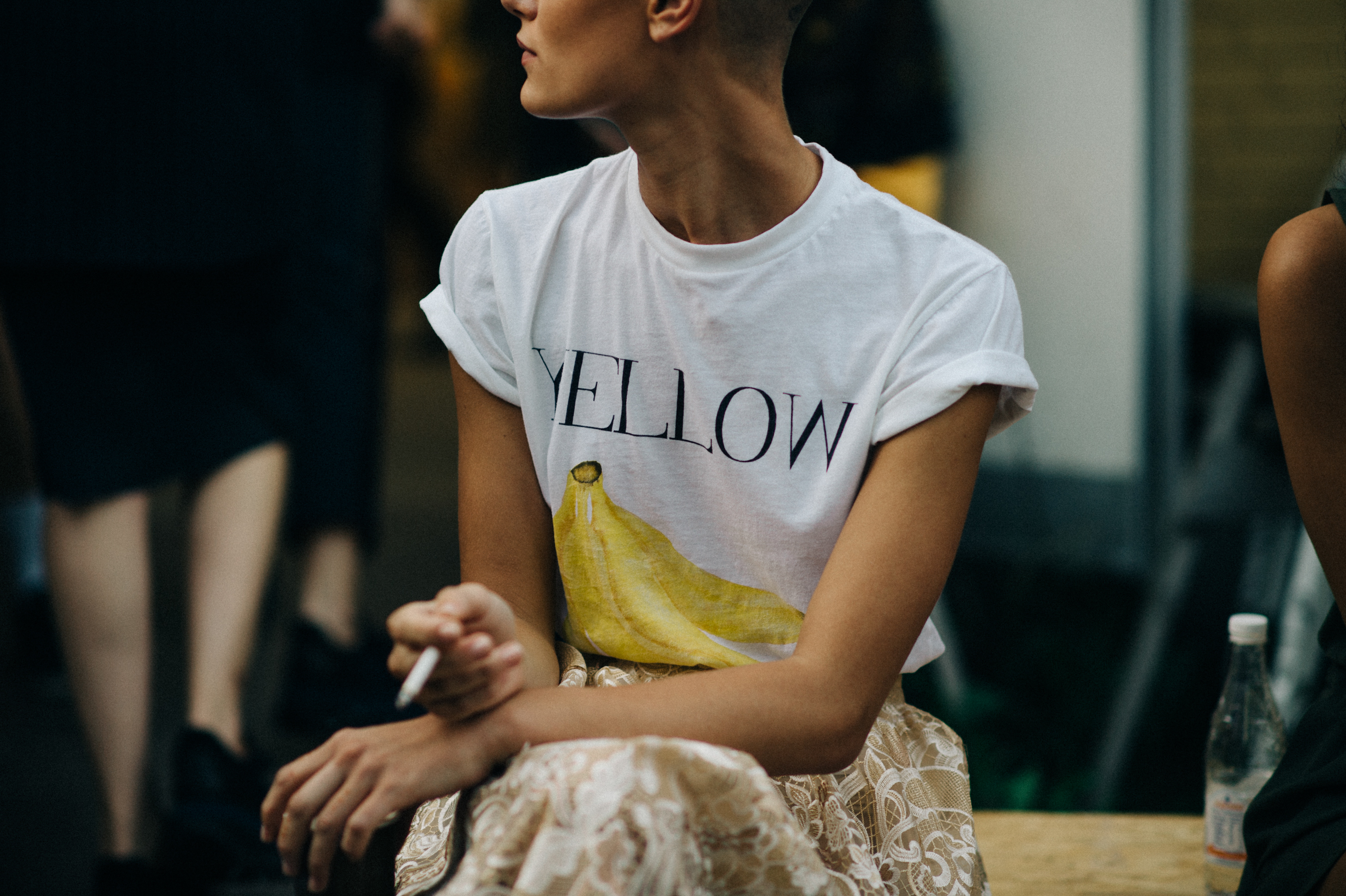 Model in t shirt with banana print smoking