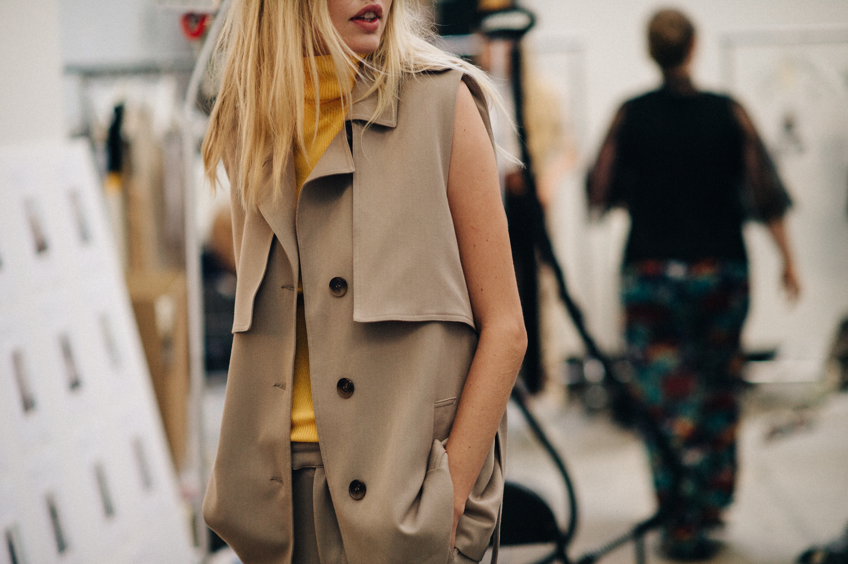 Blonde model dressed before the show