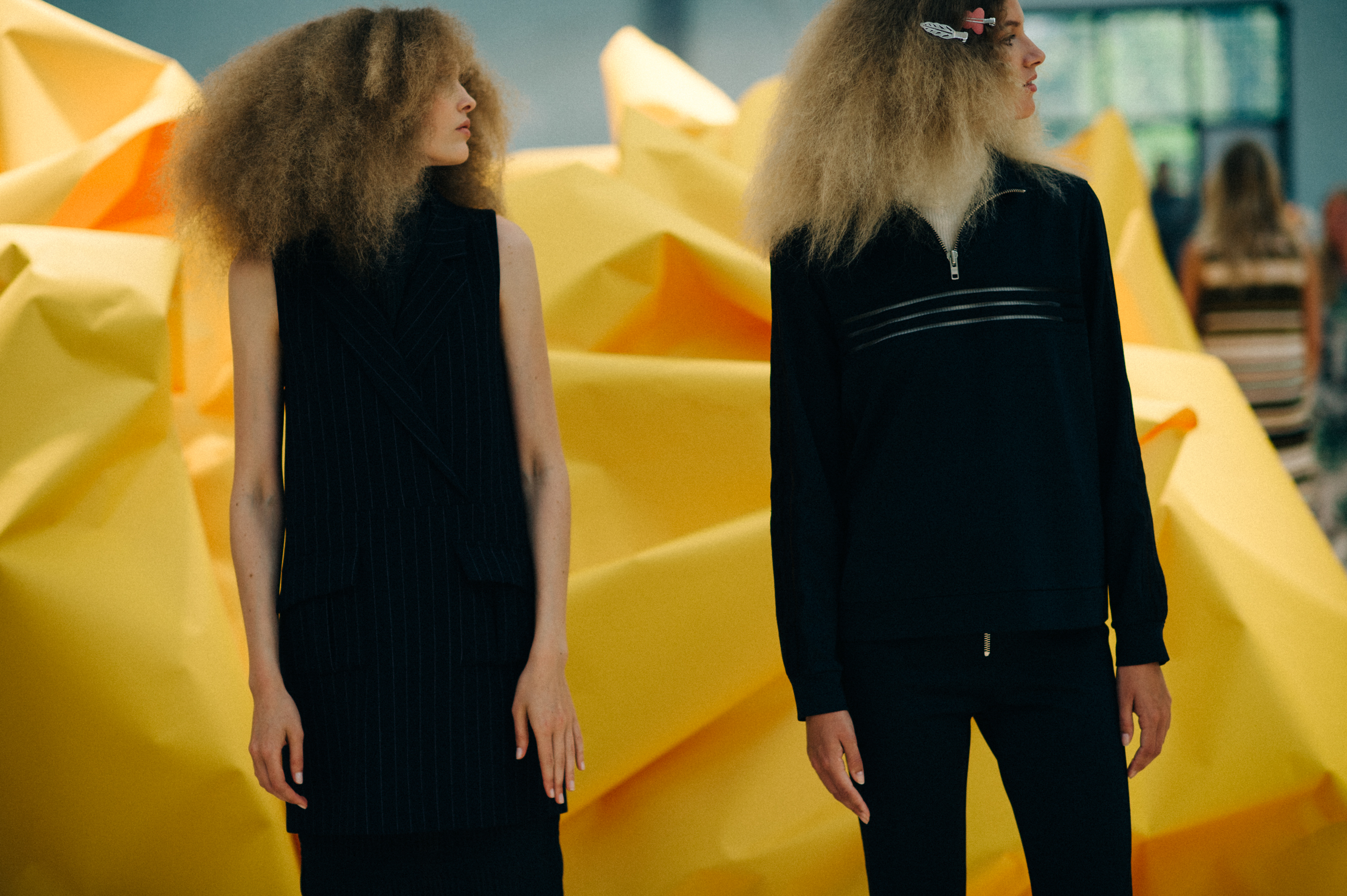 Two curly models at the rehearsal