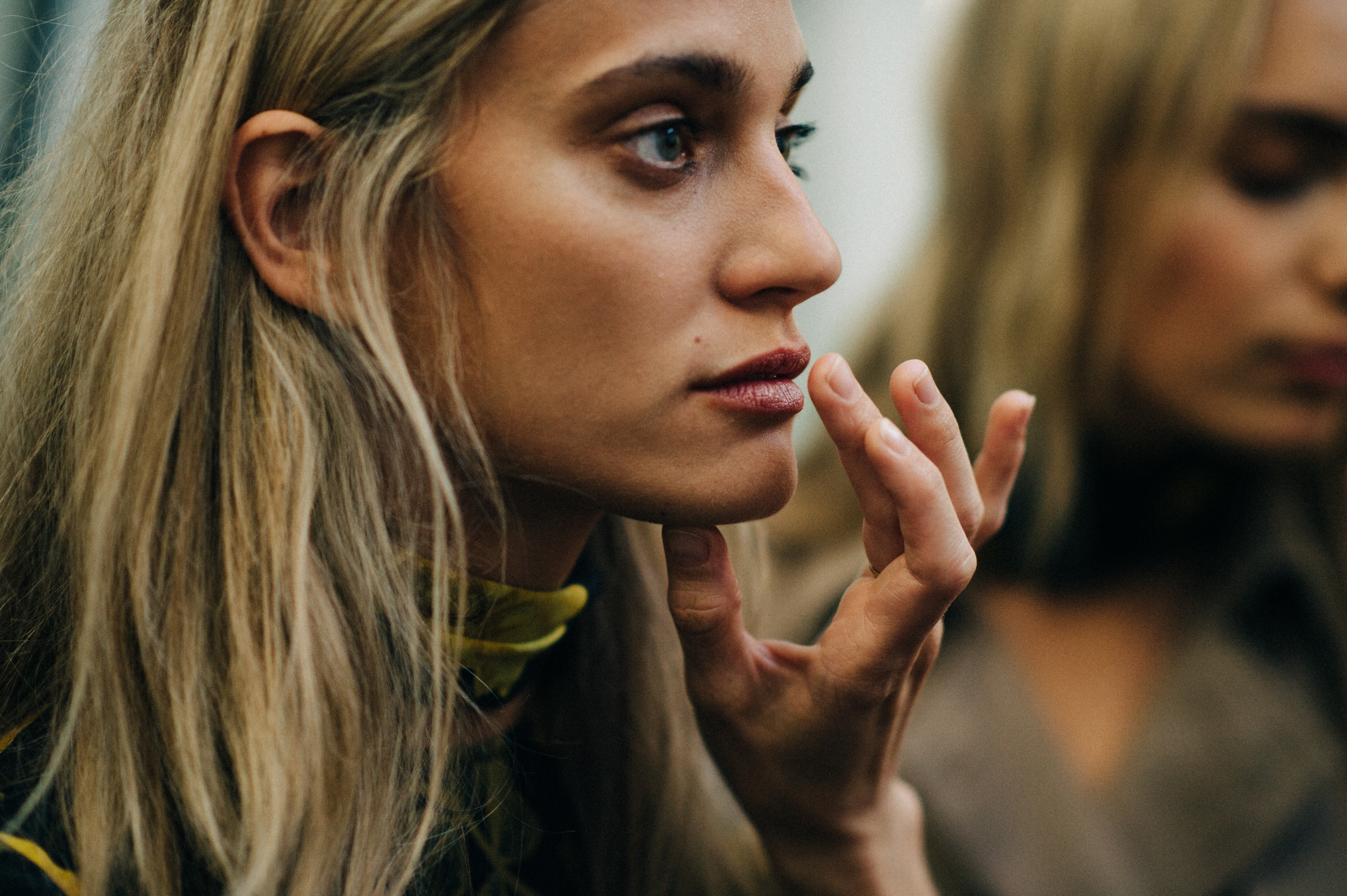 Model getting make up done before the show