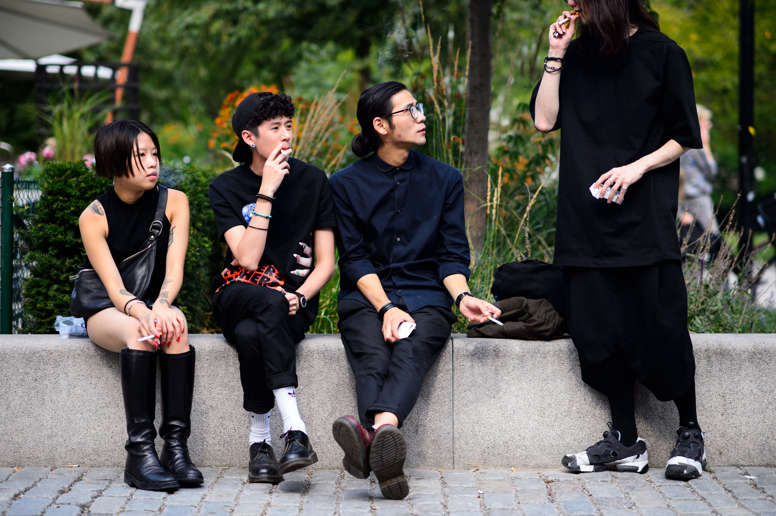 Four teenagers dressed in black outside of the show