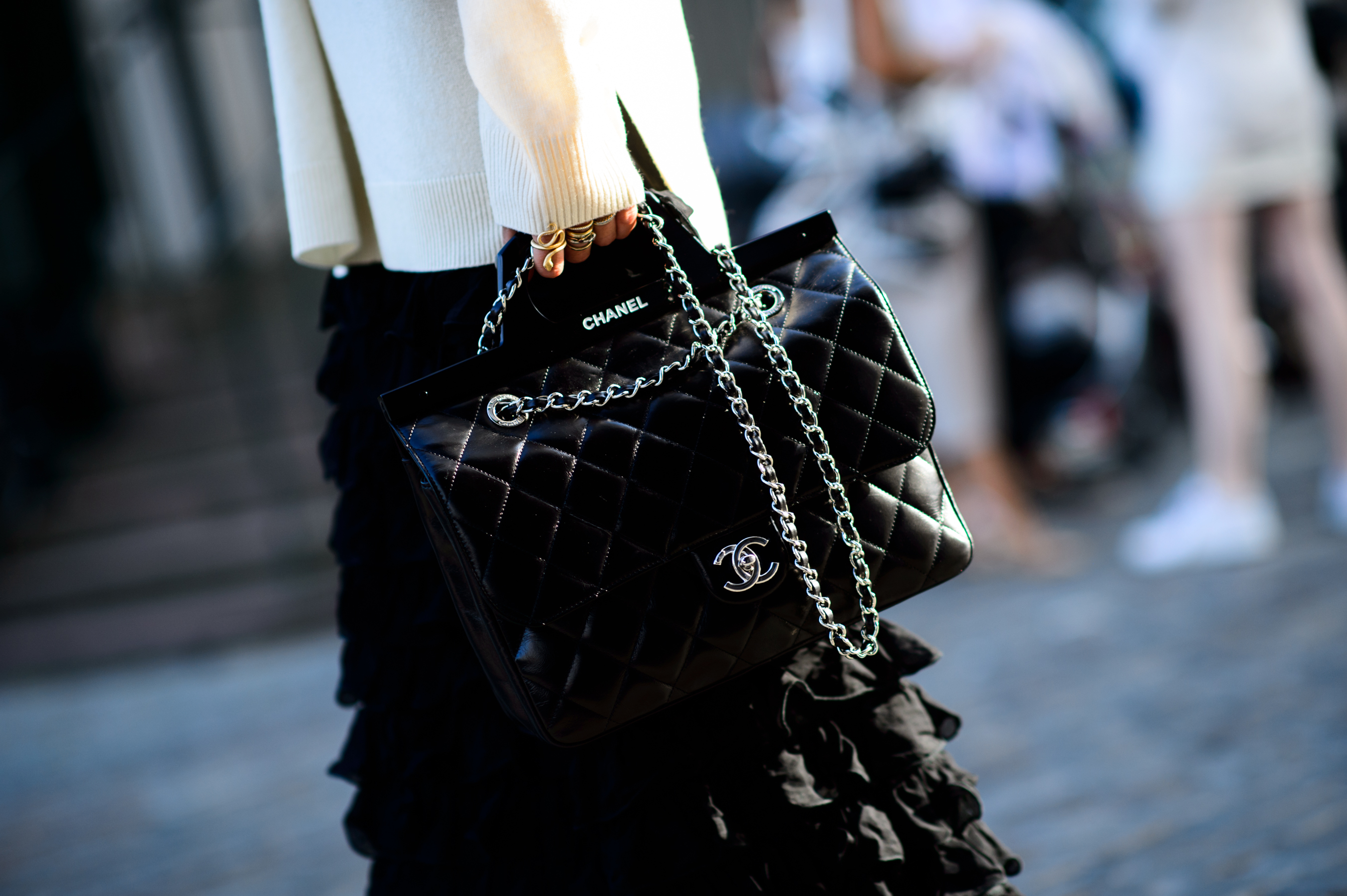 Detail photo of Chanel bag and rings