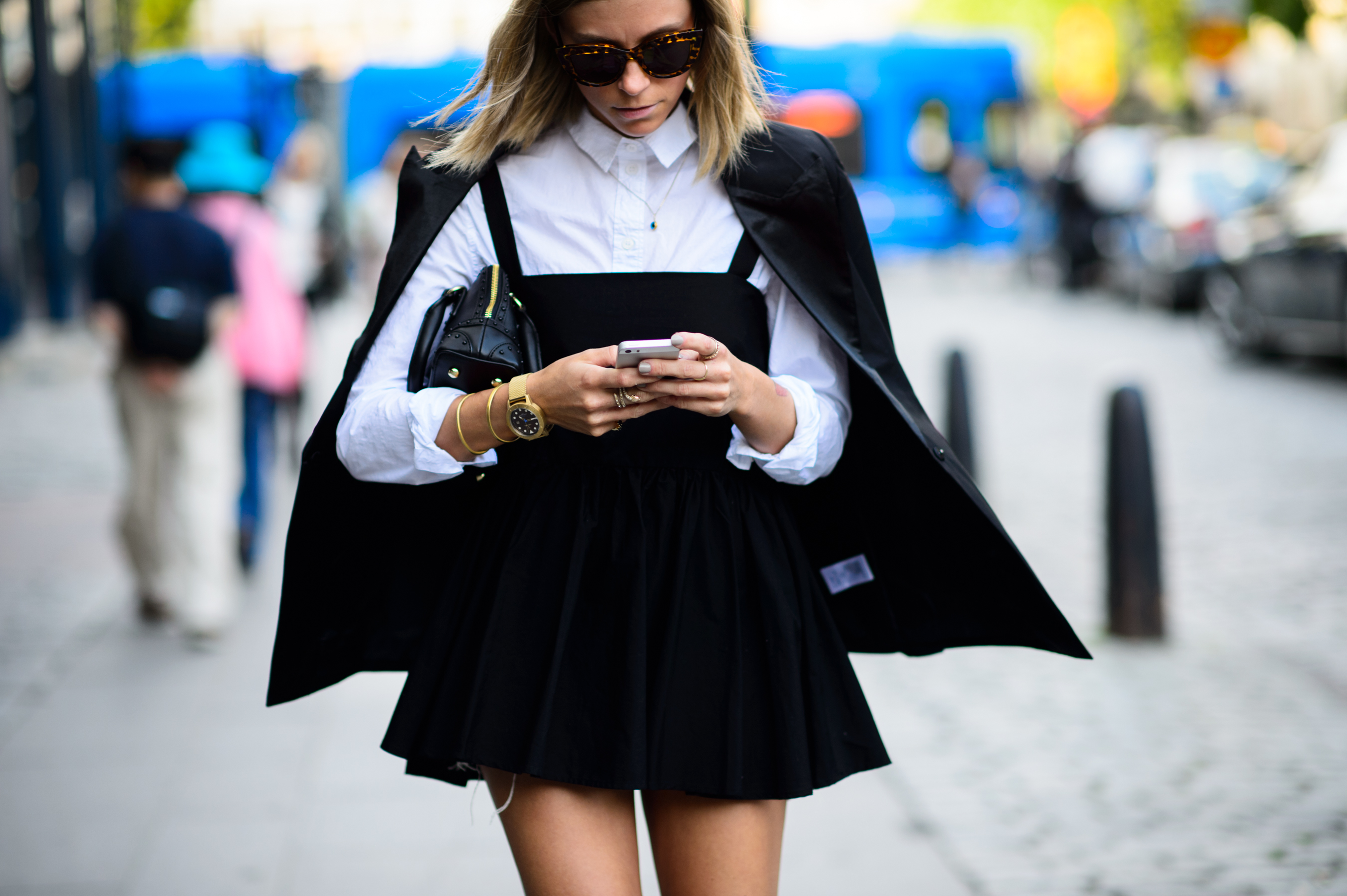 Woman wearing cape and denim before the show