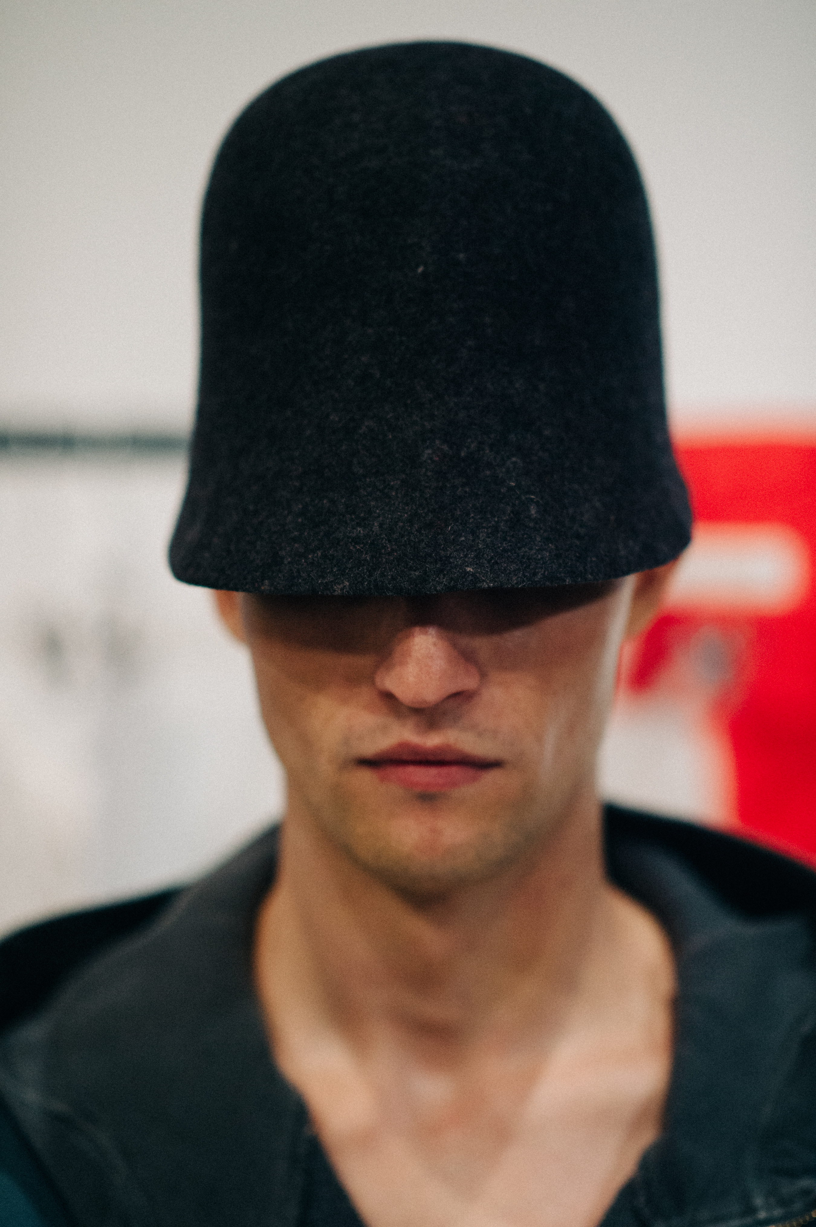 Male model wearing hat before the fashion show