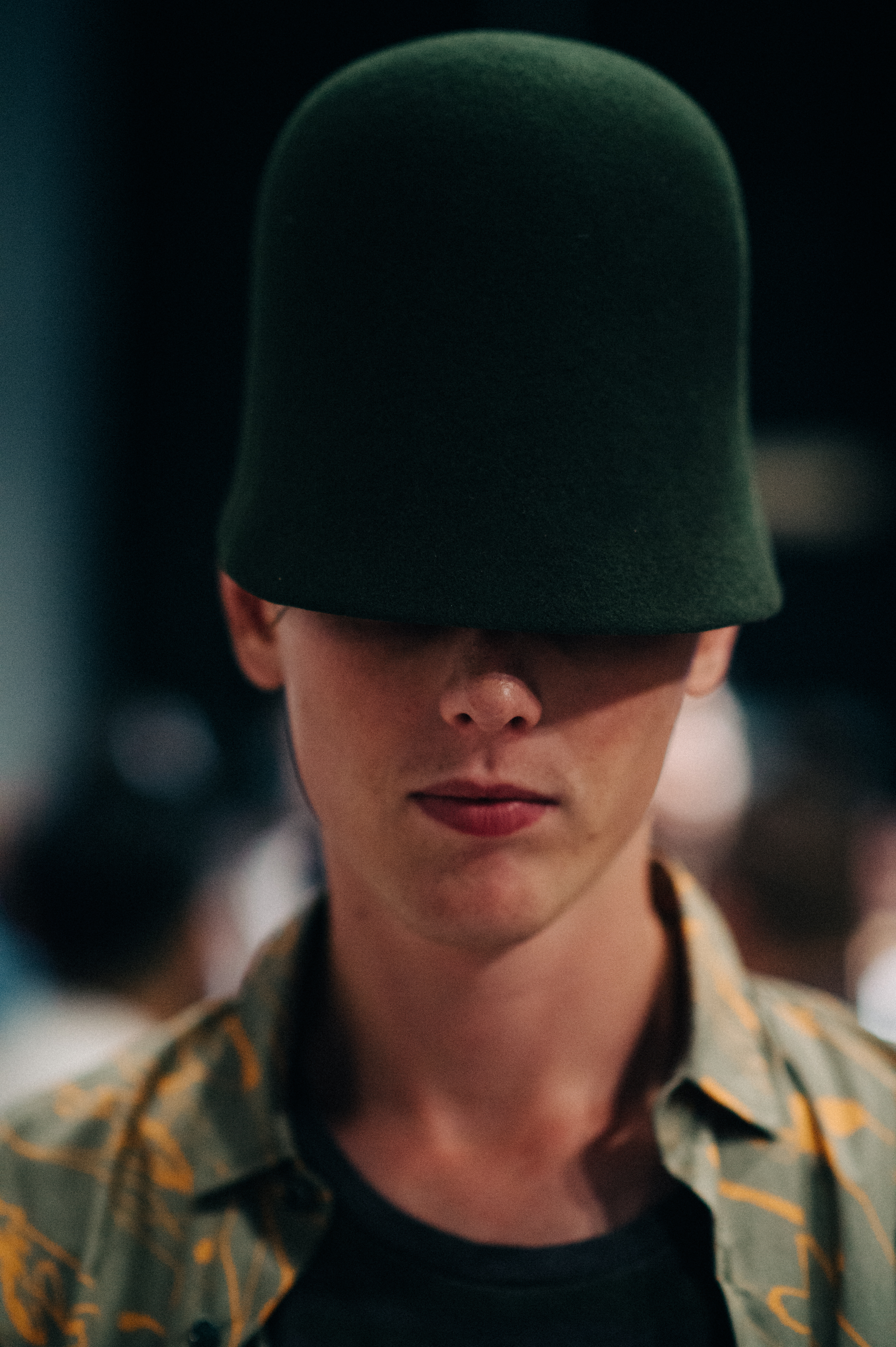 Male model wearing hat before the show