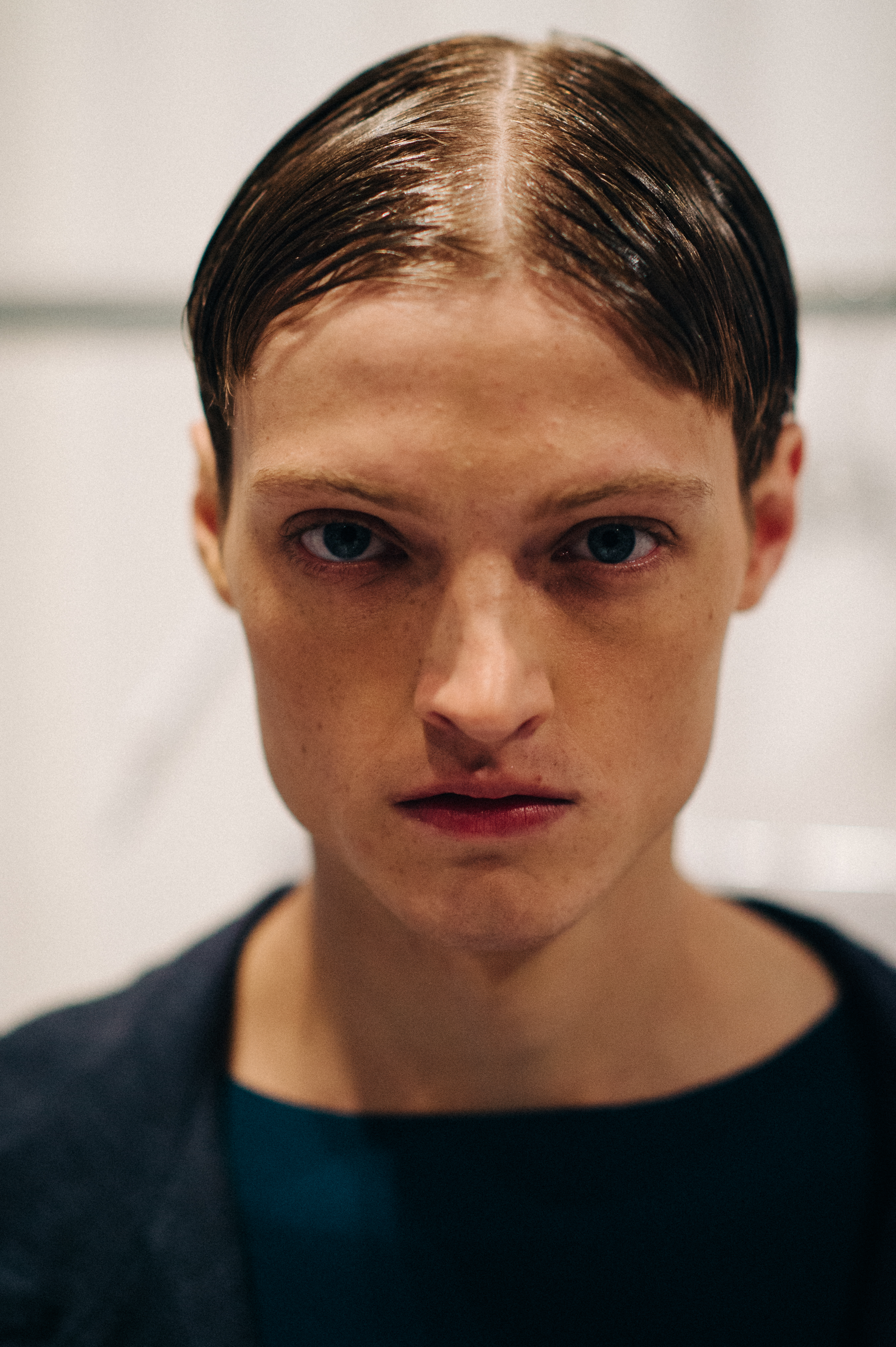Male model with wet hair before the show