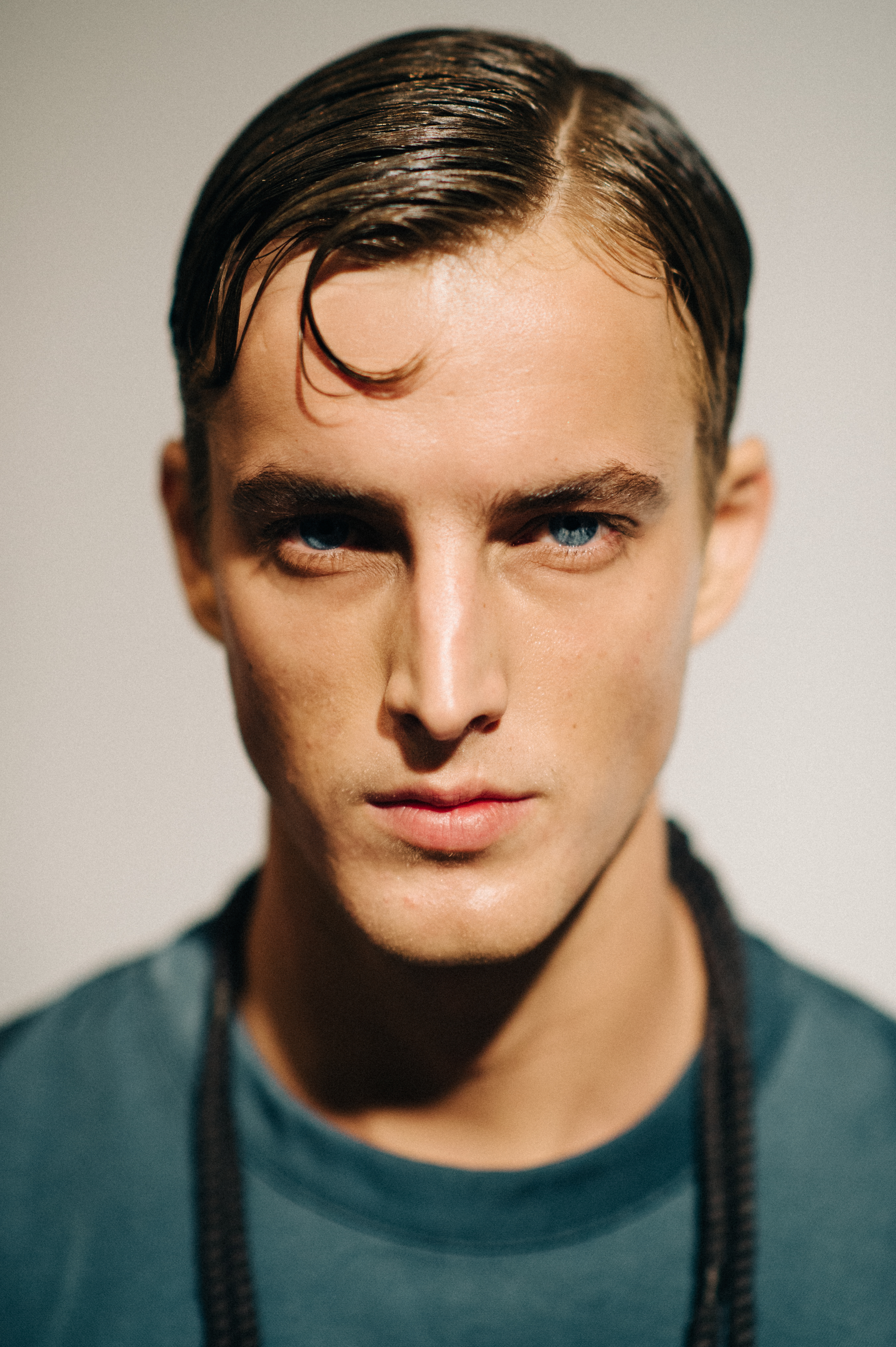 Portrait of male model with blue eyes before the show