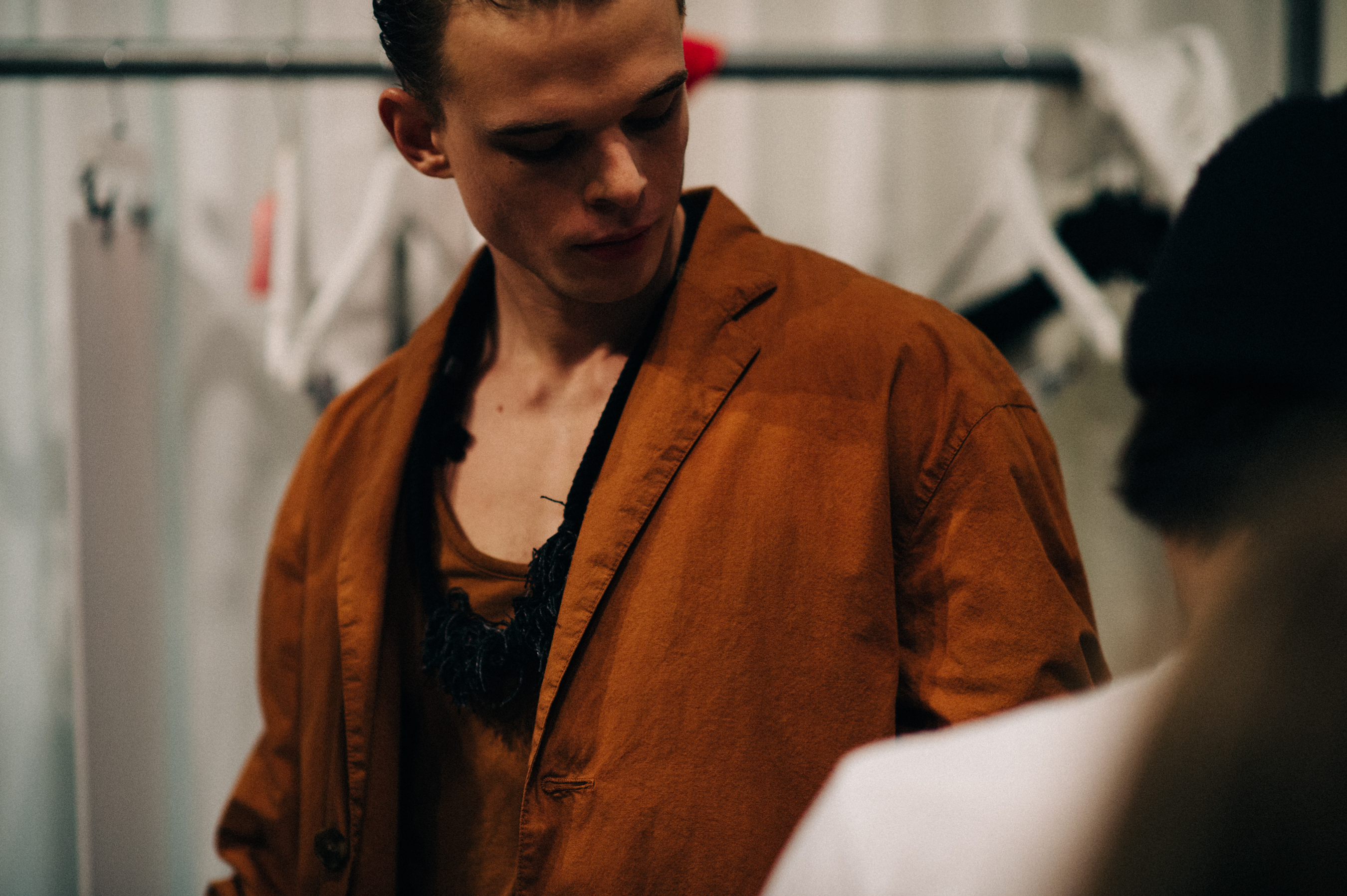 Male model wearing red before the show