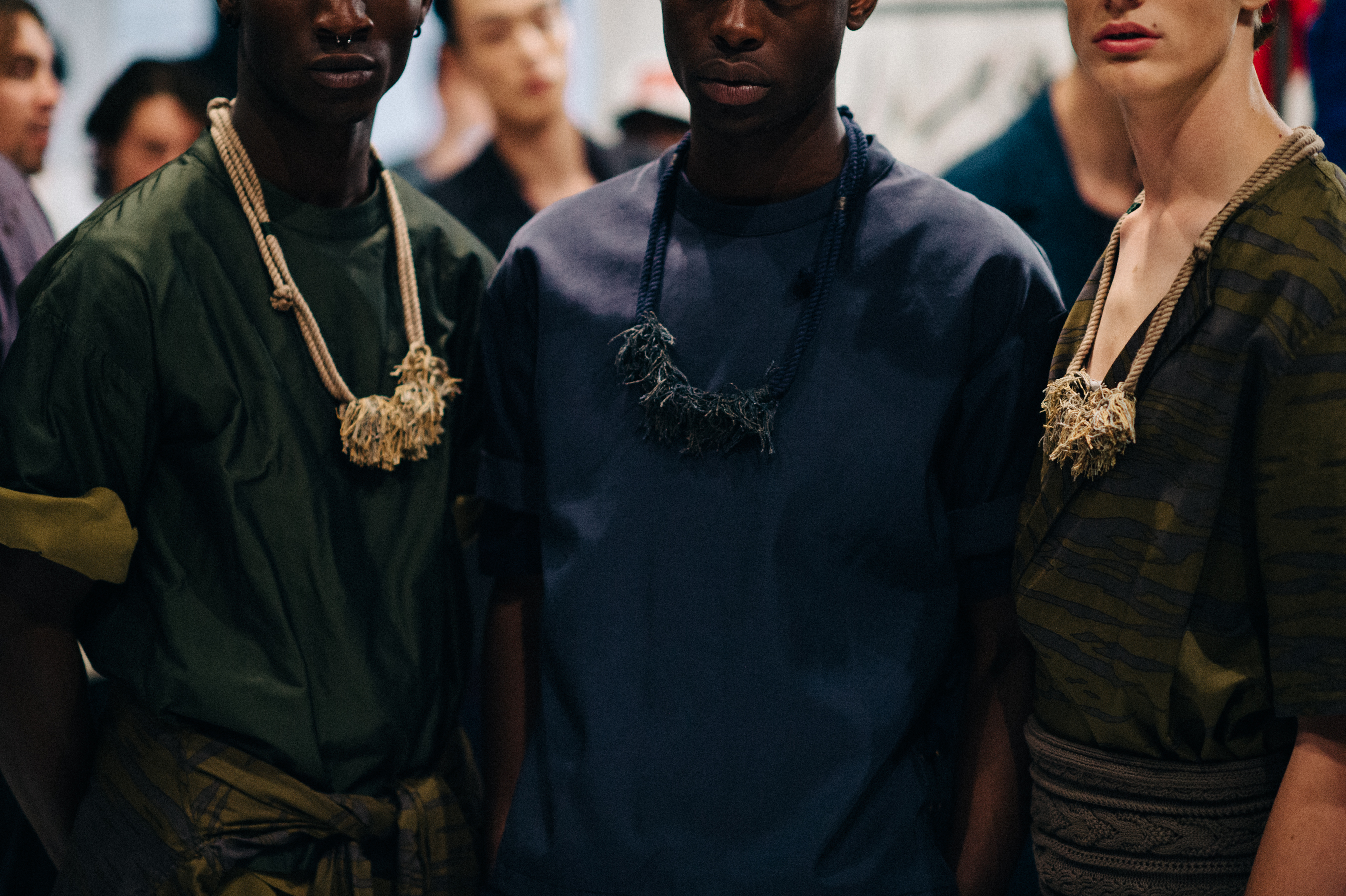 Three male models before the show