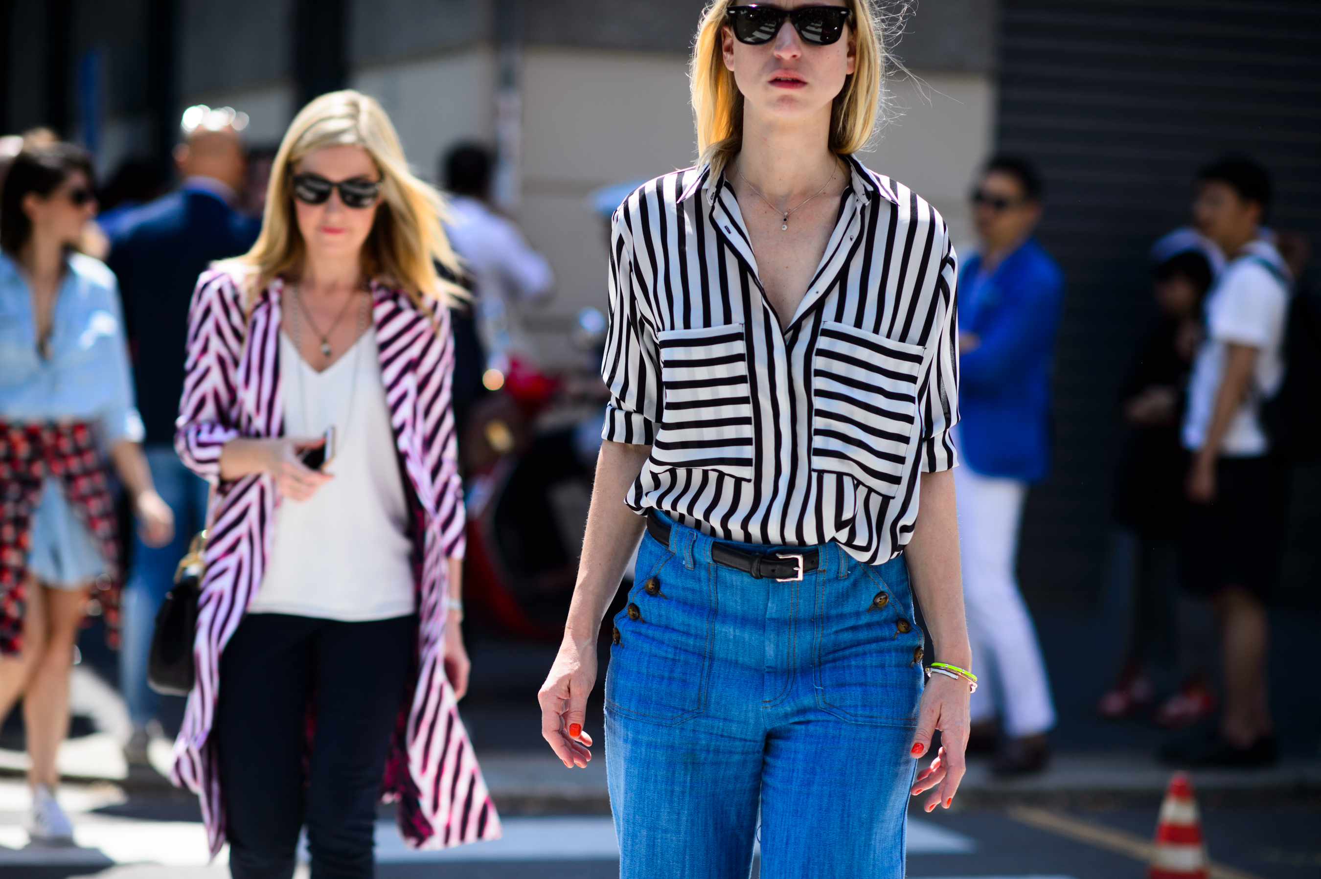 Two women in striped outfits after the show