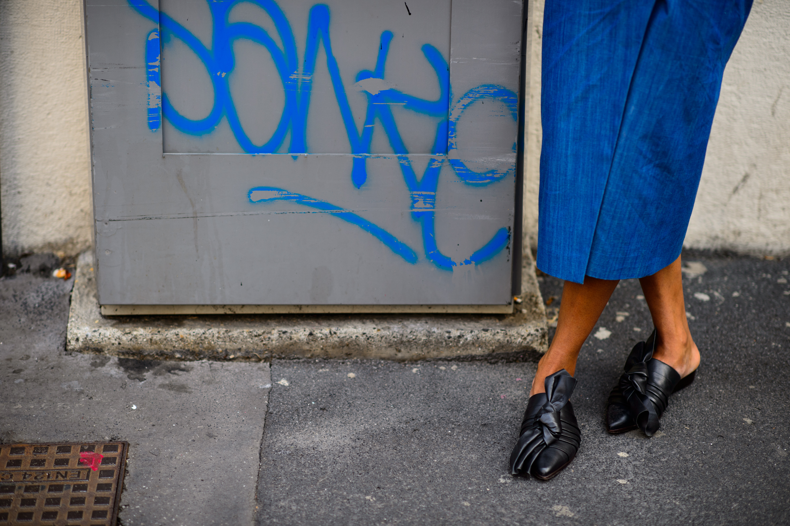 Close up shot of woman's feet wearing black sandals