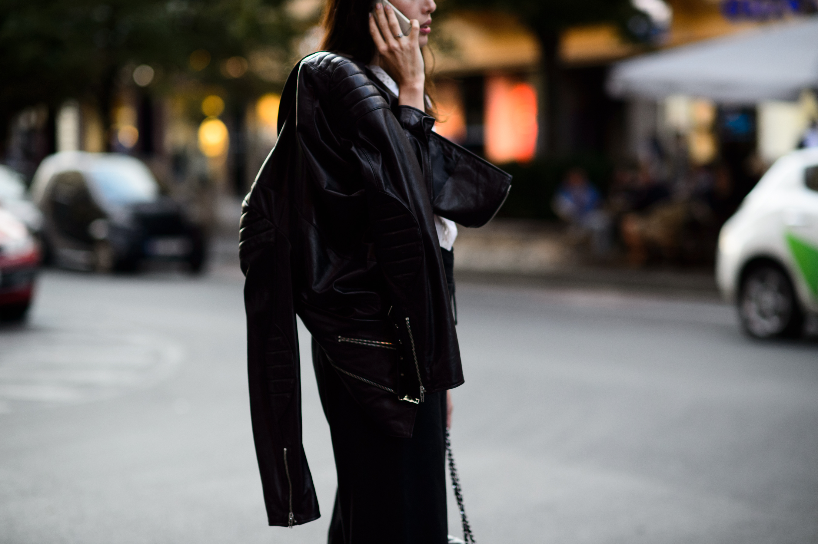 Woman wearing a leather jacket and Chanel bag