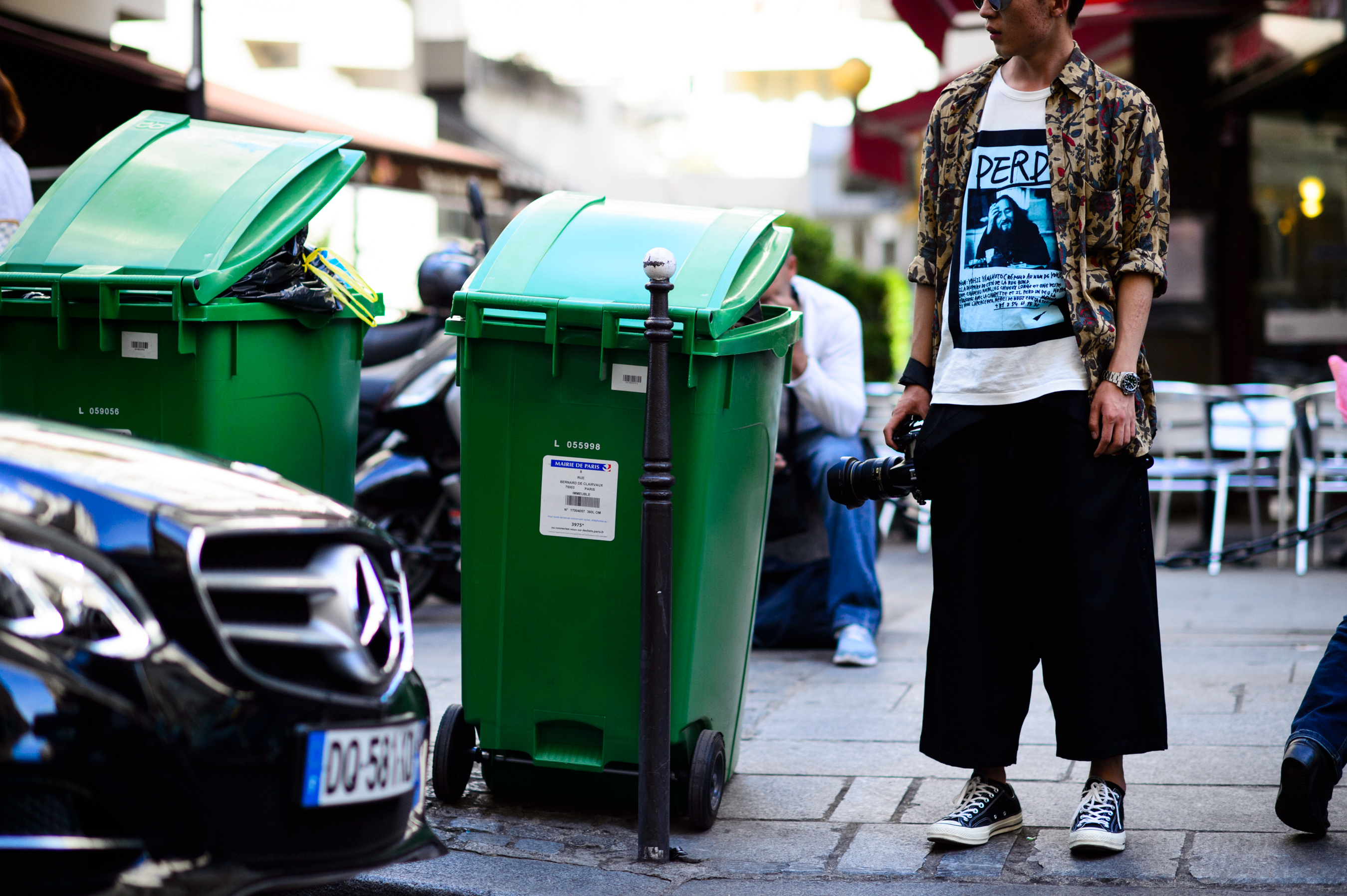 Photographer wearing t-shirt with a portrait of Japanese designer